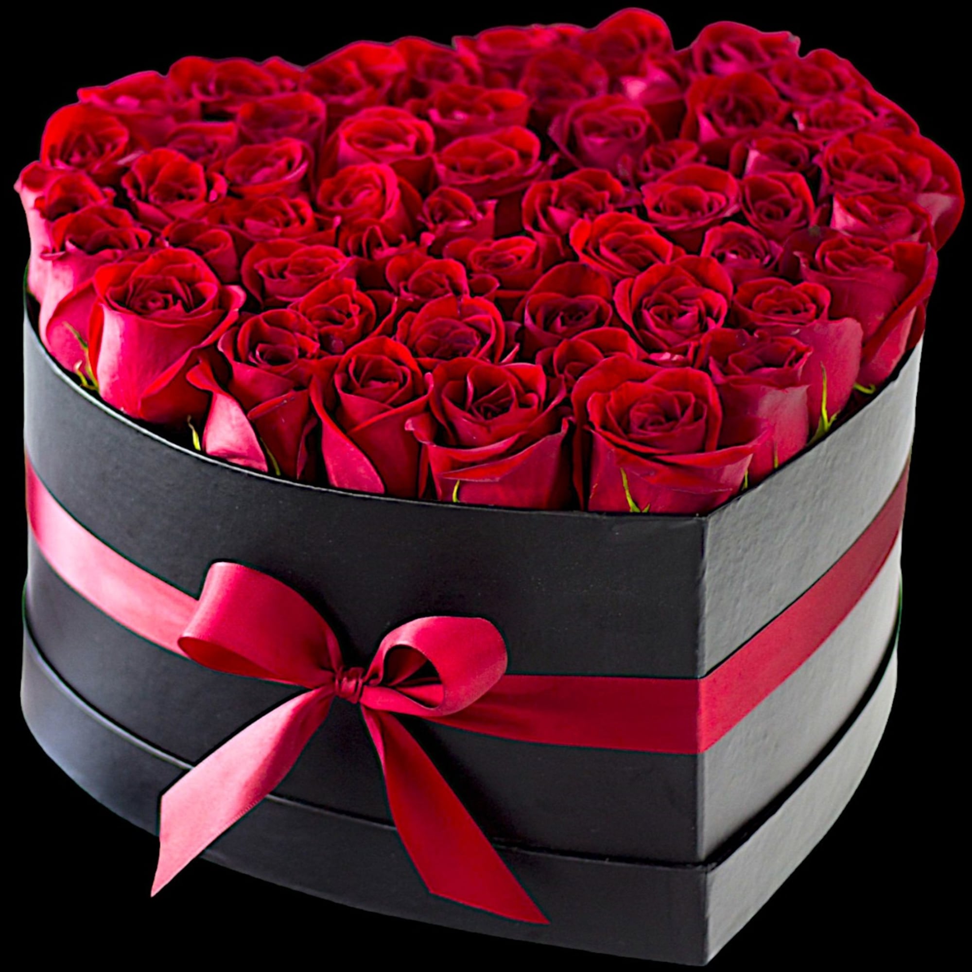 A modern flower arrangement in a heart box filled with red roses.

DETAILS
This