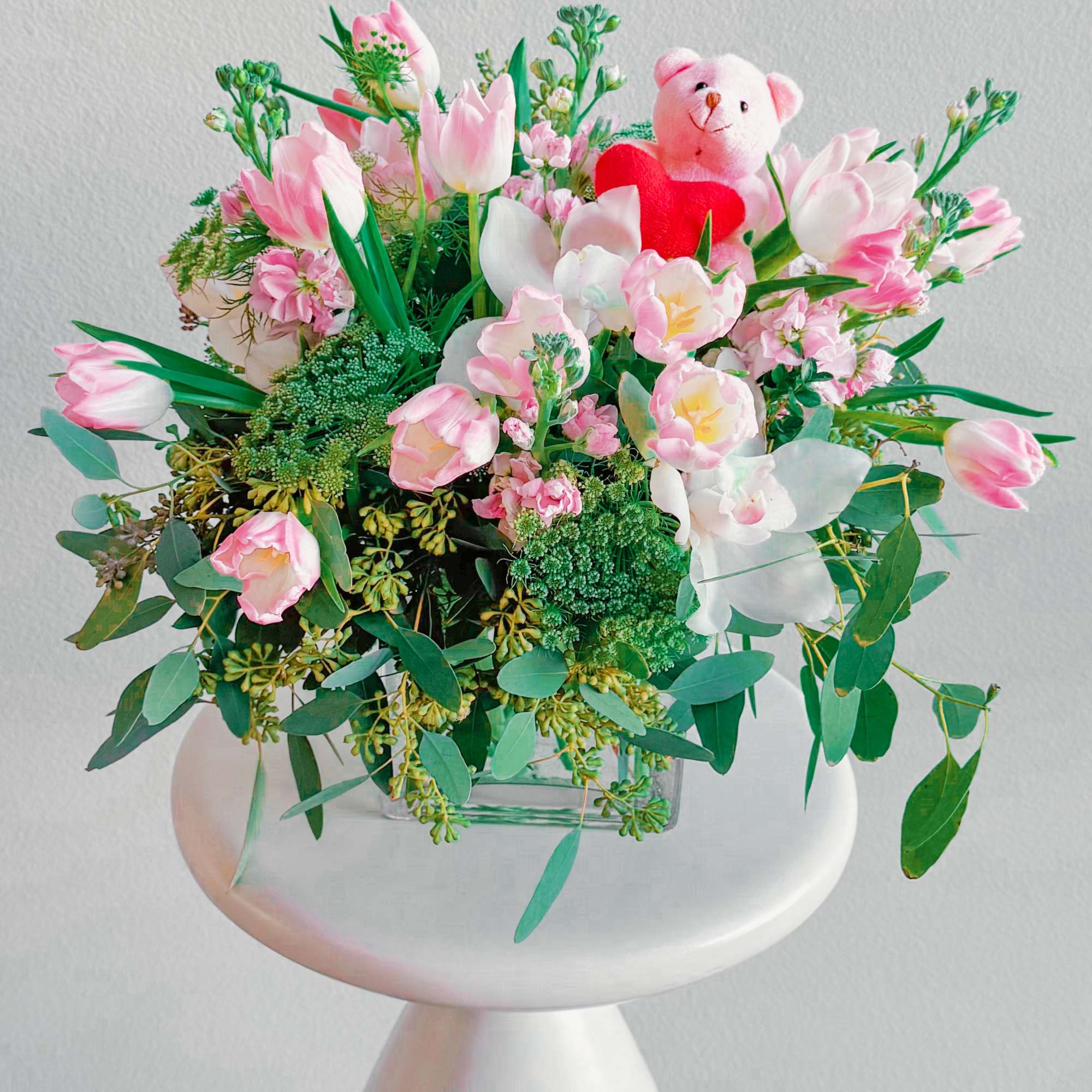 This bouquet is pure sweetness! A mix of soft pink tulips, delicate This bouquet is pure sweetness! A mix of soft pink tulips, delicate