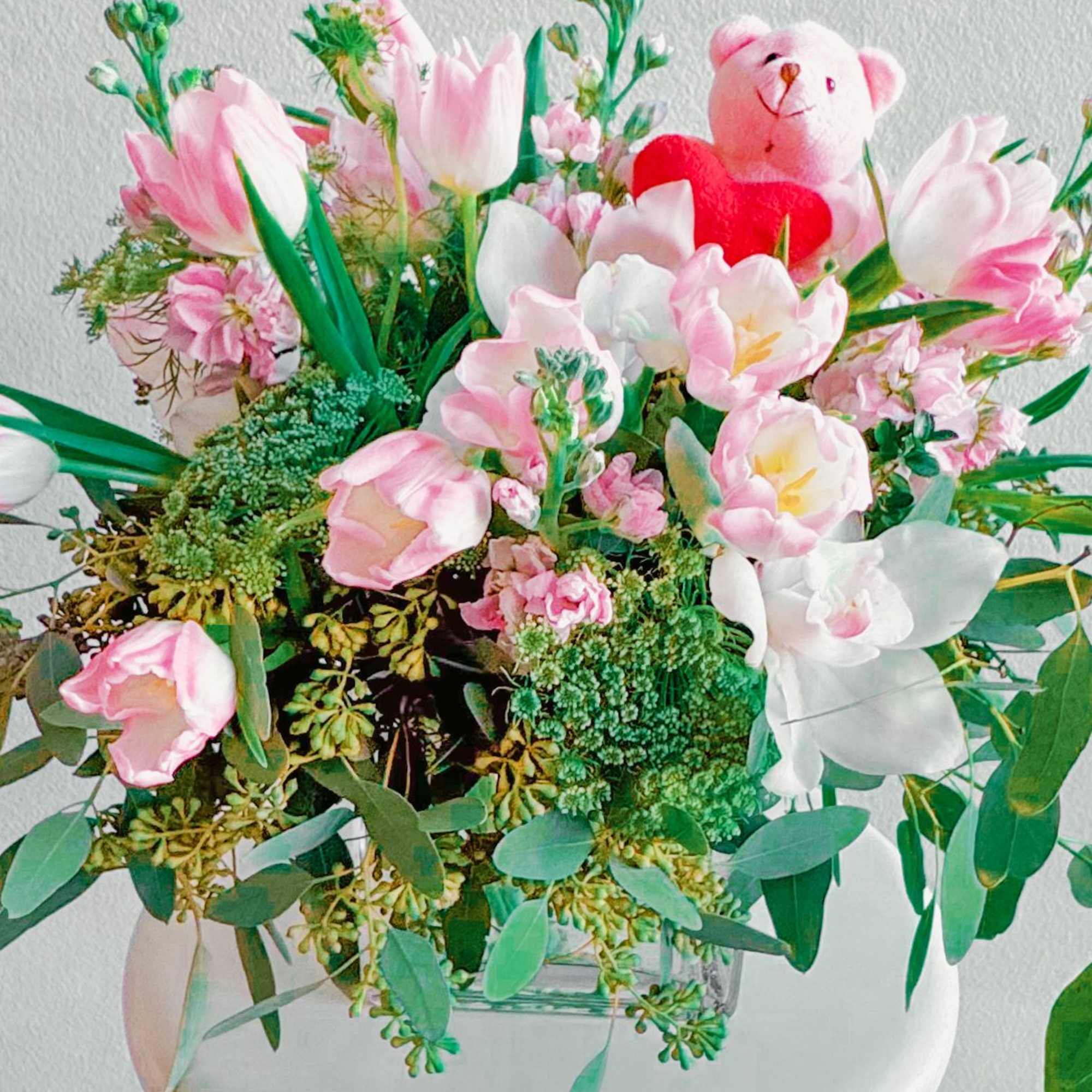 This bouquet is pure sweetness! A mix of soft pink tulips, delicate This bouquet is pure sweetness! A mix of soft pink tulips, delicate