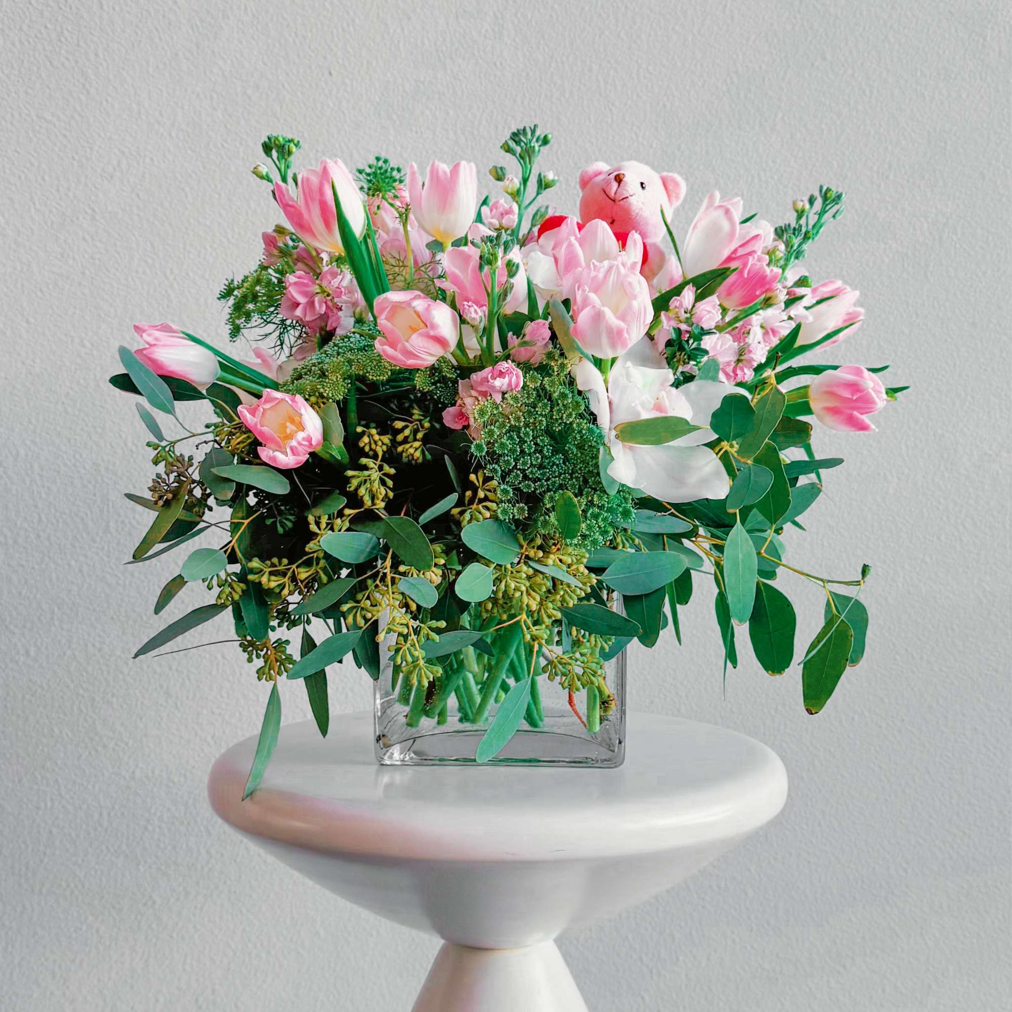 This bouquet is pure sweetness! A mix of soft pink tulips, delicate This bouquet is pure sweetness! A mix of soft pink tulips, delicate