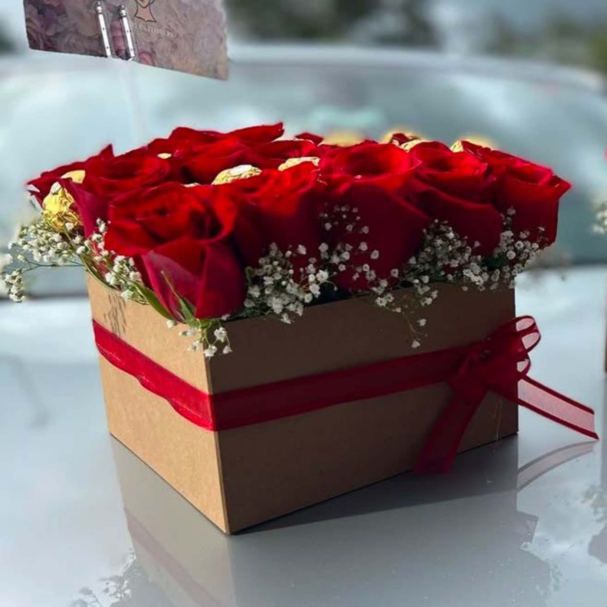 Combining a bouquet of roses and chocolates is a lovely way to Combining a bouquet of roses and chocolates is a lovely way to