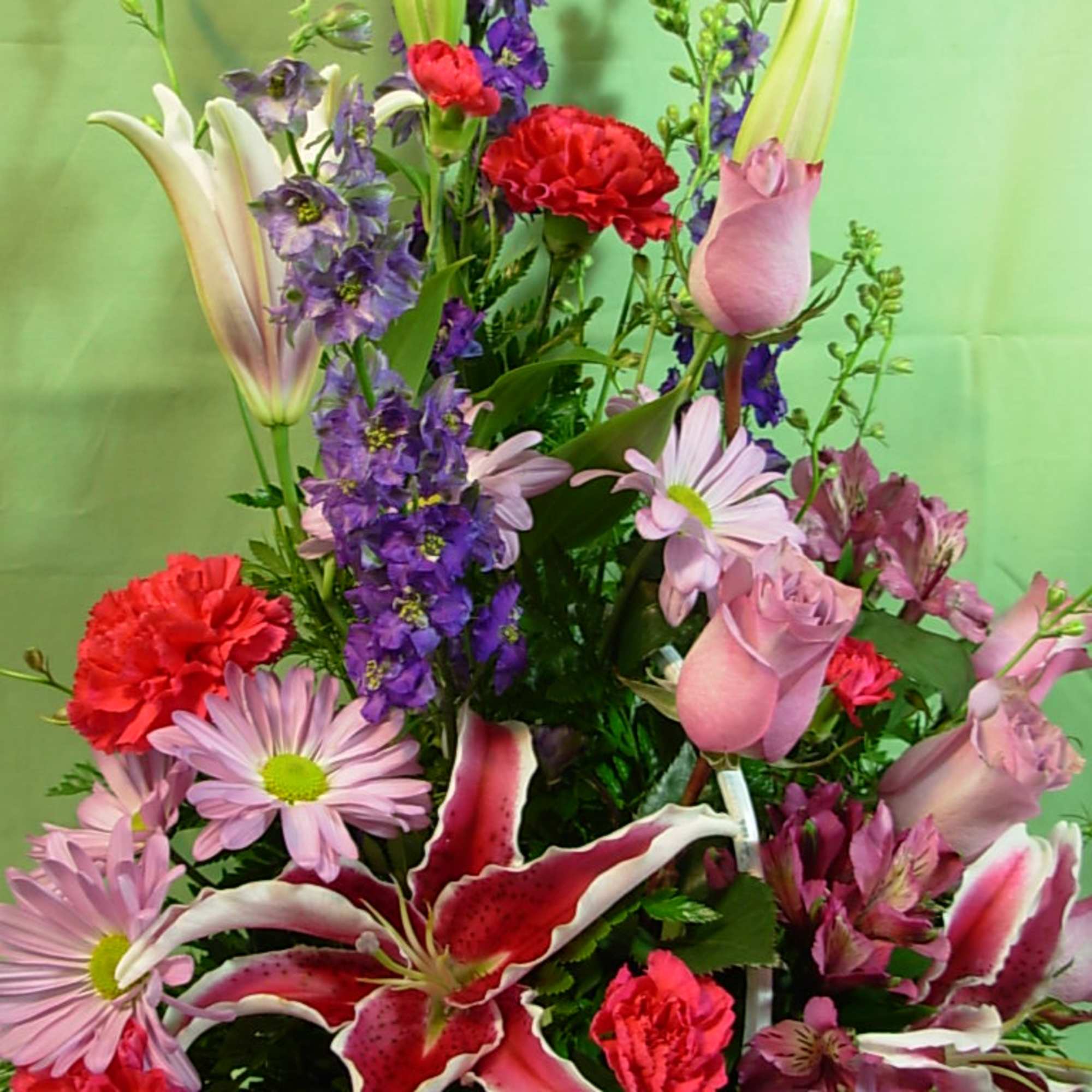 Our PASTEL BASKET OF PEACE is bright and vibrant basket arrangement of