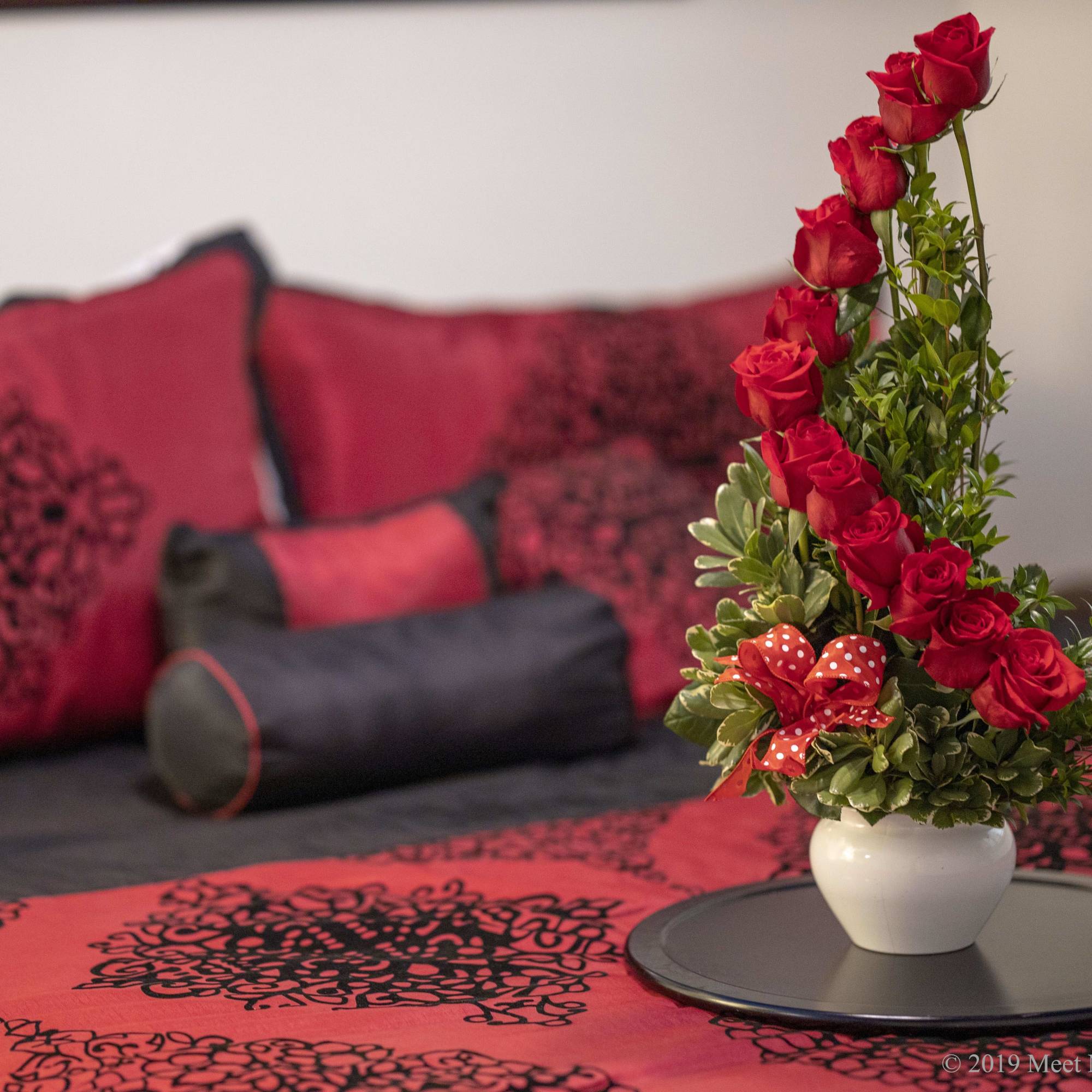 12 red roses, myrtle, and variegated greens gorgeously arranged. 12 red roses, myrtle, and variegated greens gorgeously arranged.
