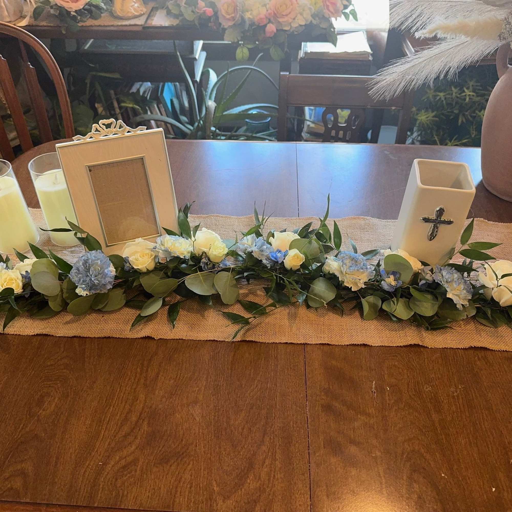 This elegant garland contains, roses, carnations, eucalypts, &amp; some other beautiful greens