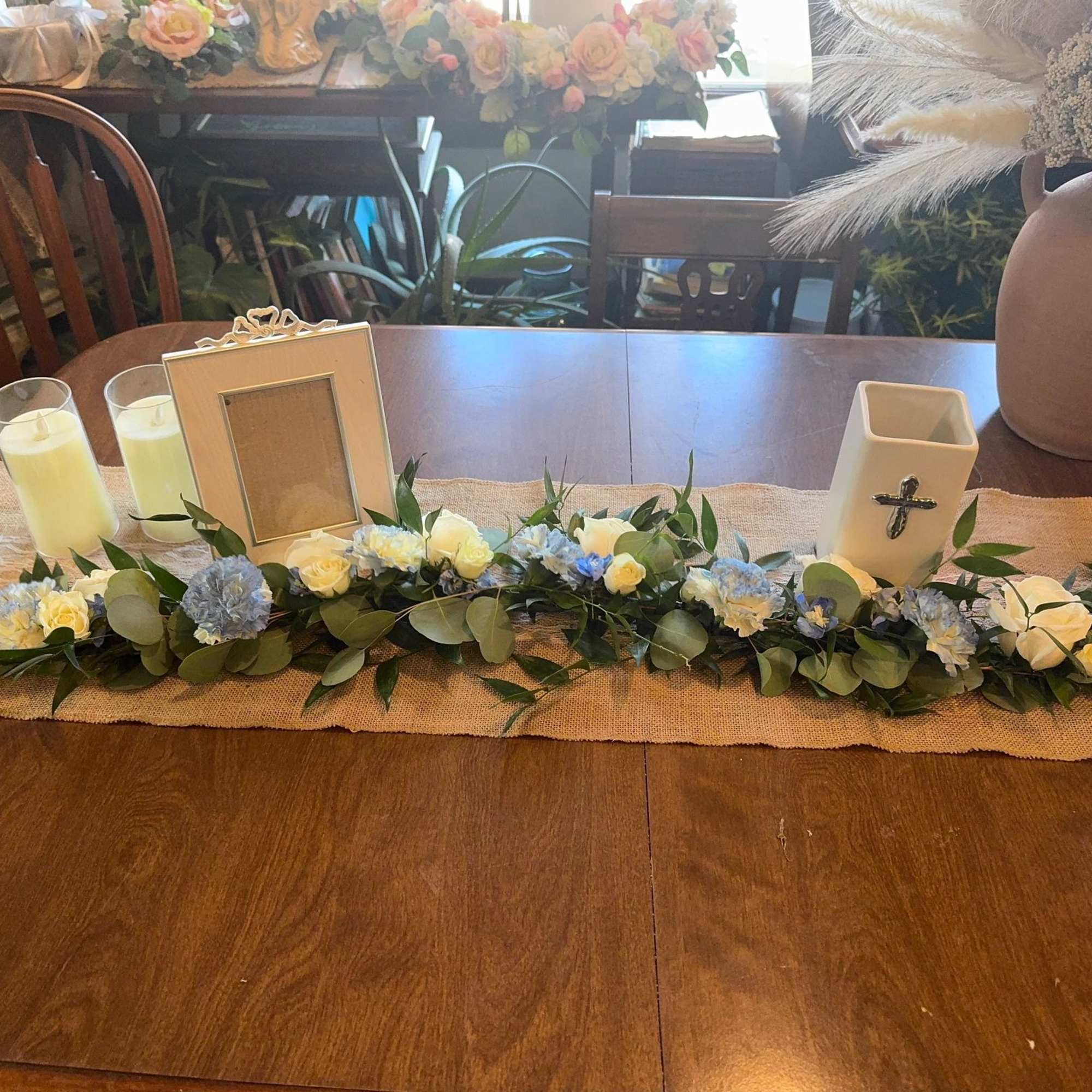 This elegant garland contains, roses, carnations, eucalypts, &amp; some other beautiful greens