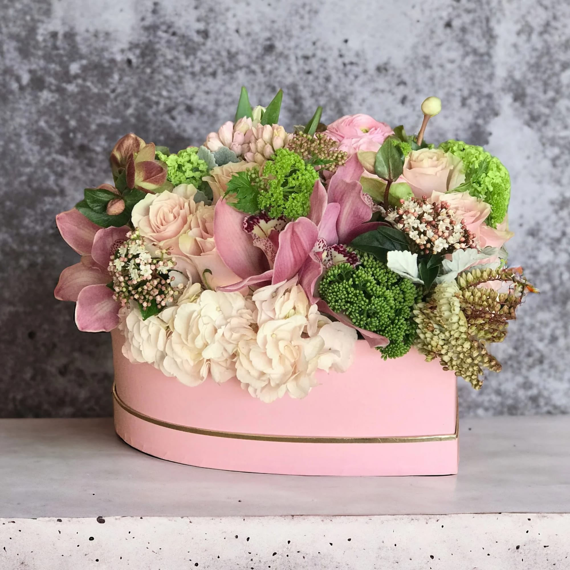 Beautiful heart shaped box, filled with a variety of beautiful spring blooms Beautiful heart shaped box, filled with a variety of beautiful spring blooms