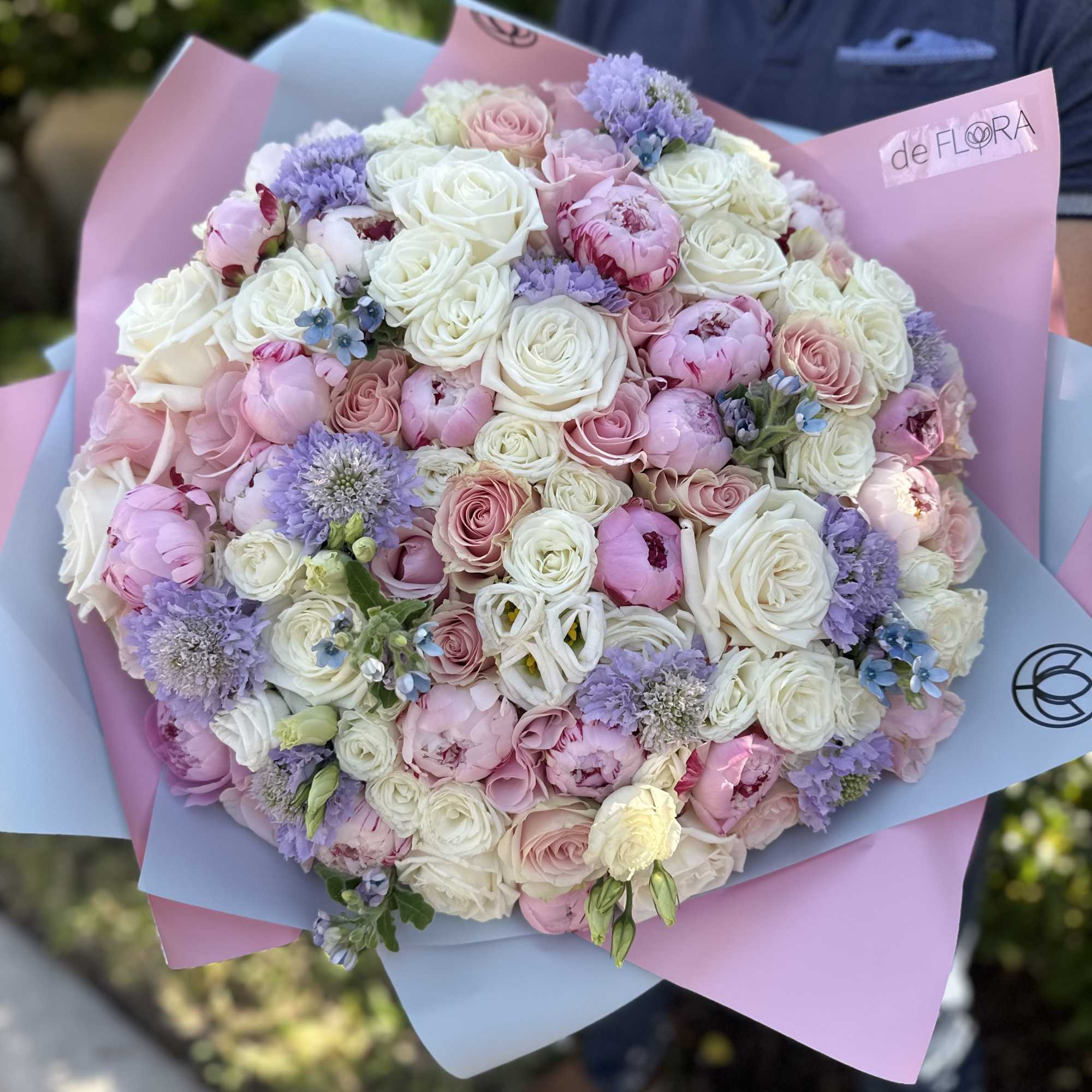 Large bouquet of peonies, roses, spray roses, lisianthus in pink and blue Large bouquet of peonies, roses, spray roses, lisianthus in pink and blue