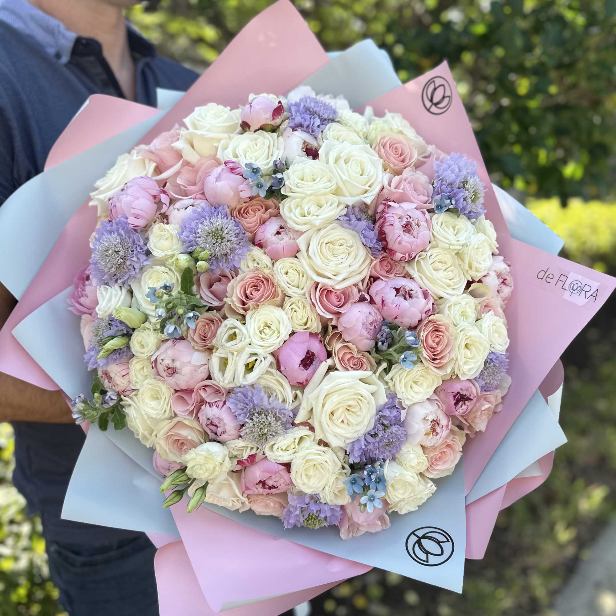 Large bouquet of peonies, roses, spray roses, lisianthus in pink and blue Large bouquet of peonies, roses, spray roses, lisianthus in pink and blue