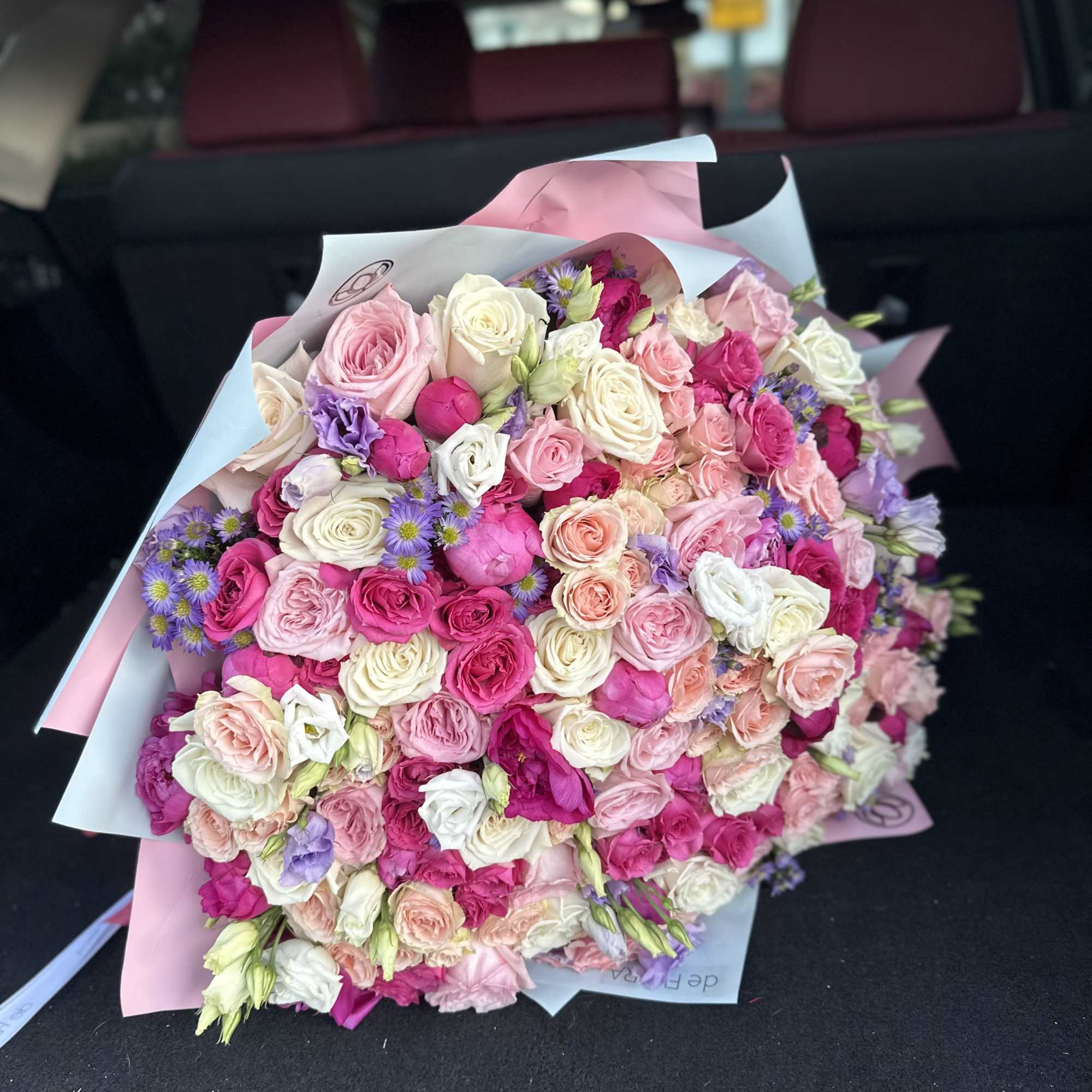 Large bouquet of peonies, roses, spray roses, lisianthus in pink and blue Large bouquet of peonies, roses, spray roses, lisianthus in pink and blue