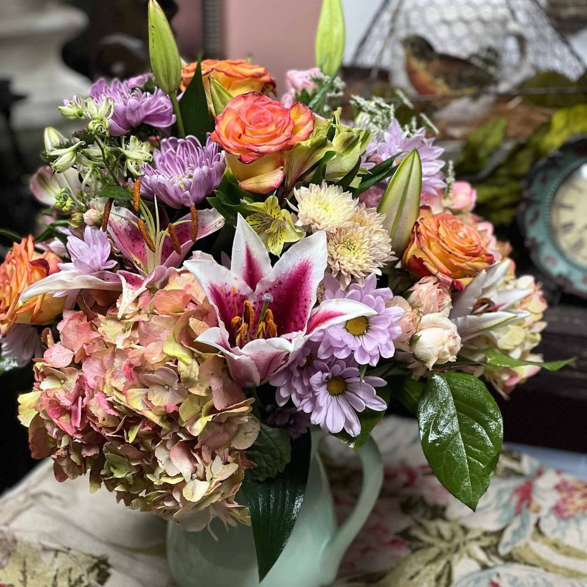 Designers Choice of Pastel Tone Florals placed in a large sized lined