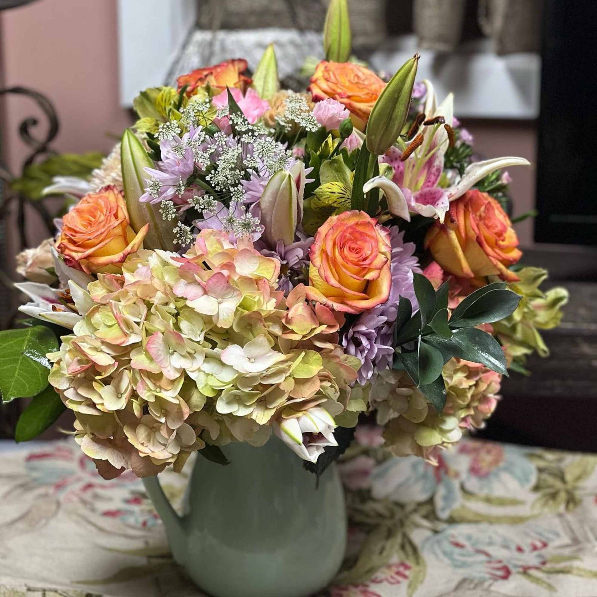 Designers Choice of Pastel Tone Florals placed in a large sized lined