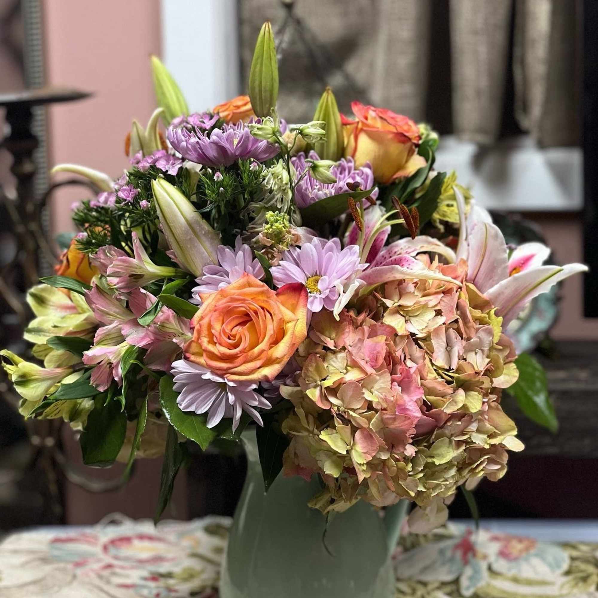 Designers Choice of Pastel Tone Florals placed in a large sized lined