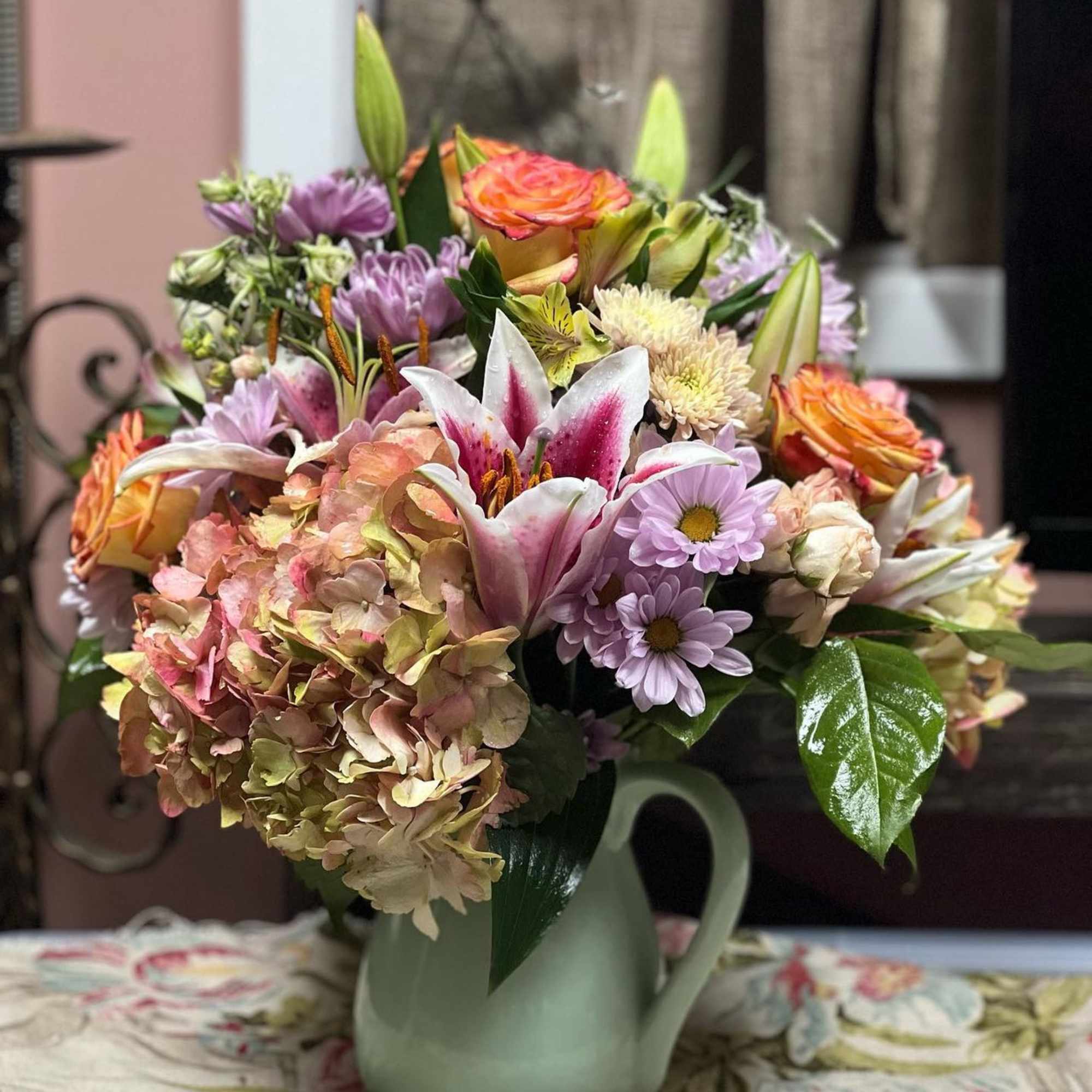 Designers Choice of Pastel Tone Florals placed in a large sized lined