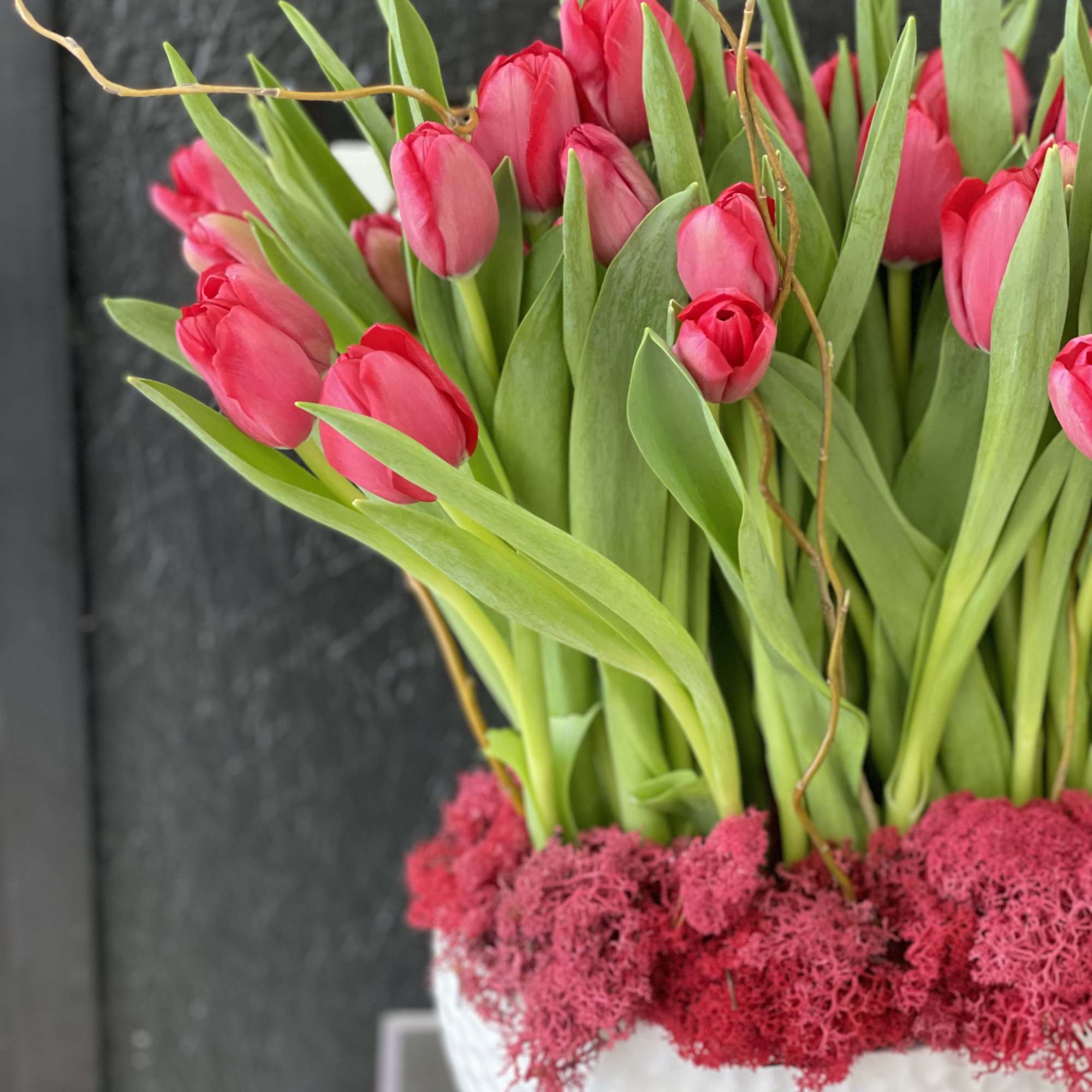 Modern arrangement filled with fresh cut tulips. Elegant arrangement Filled with 40-50