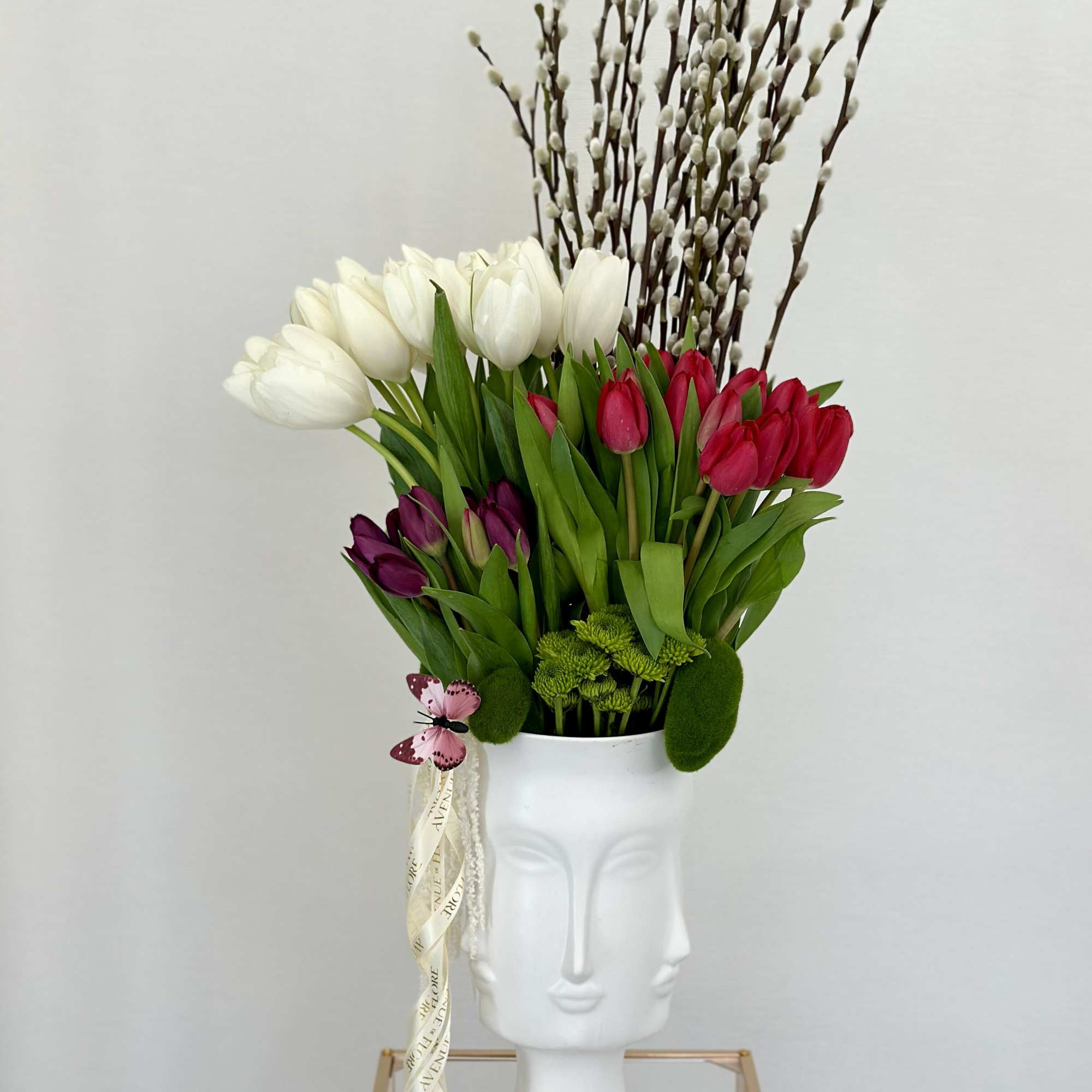 A captivating arrangement nestled within an elegant vase, featuring a delightful mix