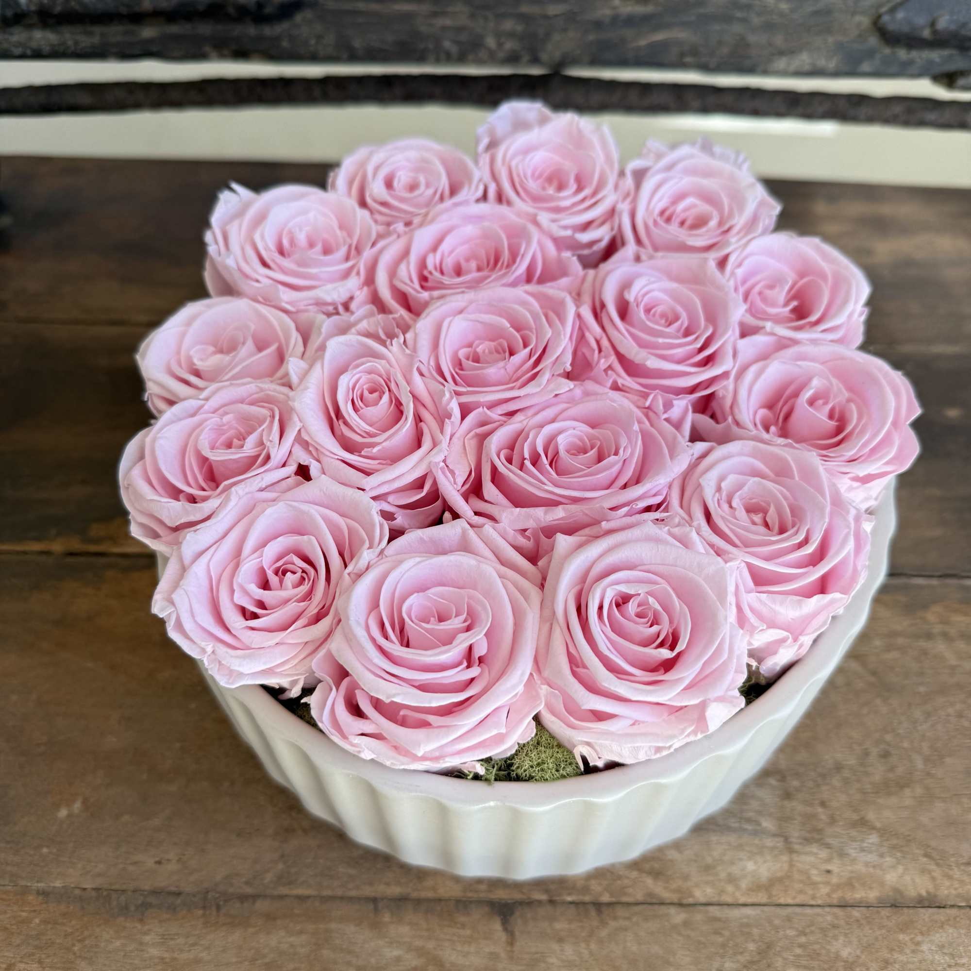 Elegant and timeless, this arrangement features long-lasting pink roses displayed in a Elegant and timeless, this arrangement features long-lasting pink roses displayed in a