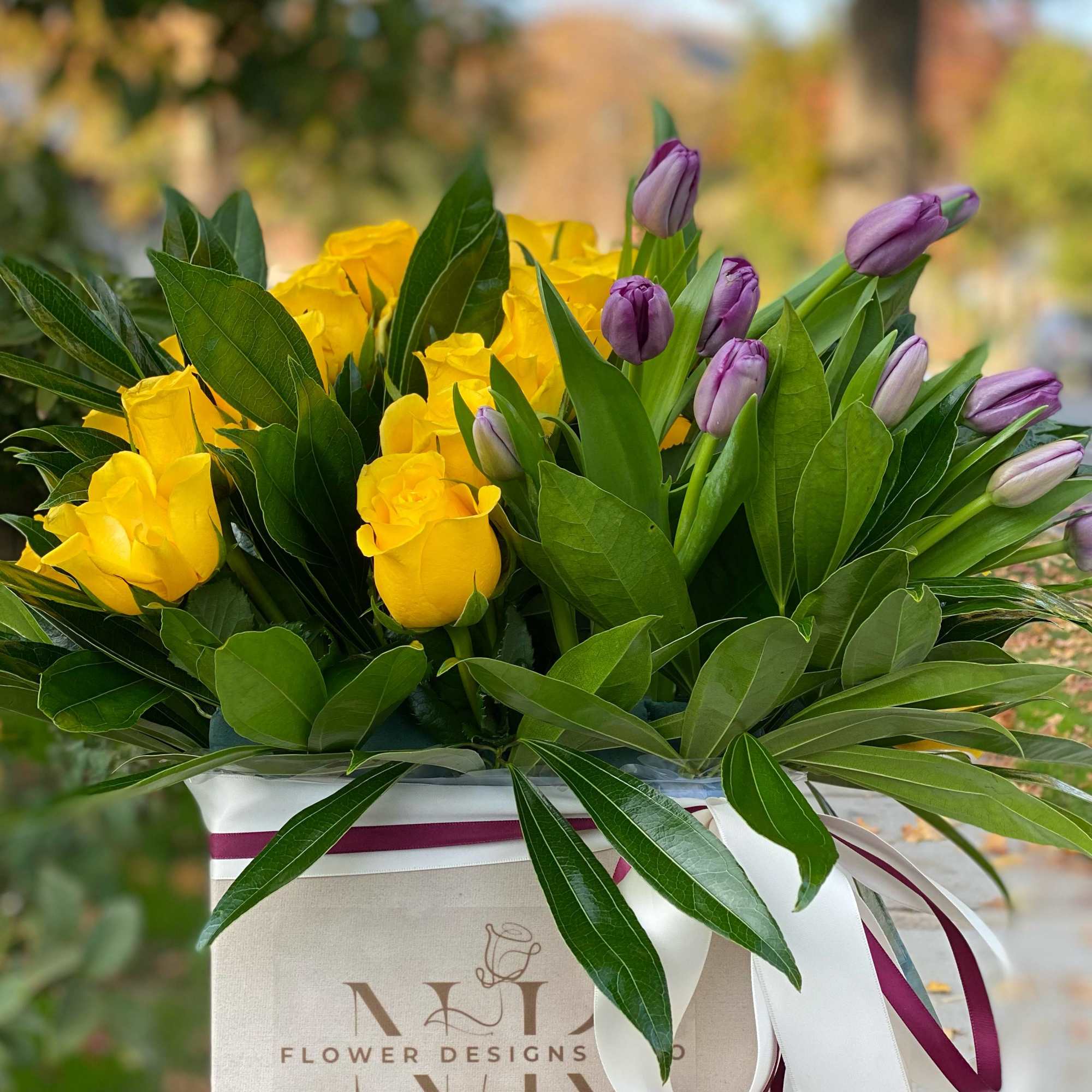 What a beautiful color game this arrangement has! This boxed arrangement is