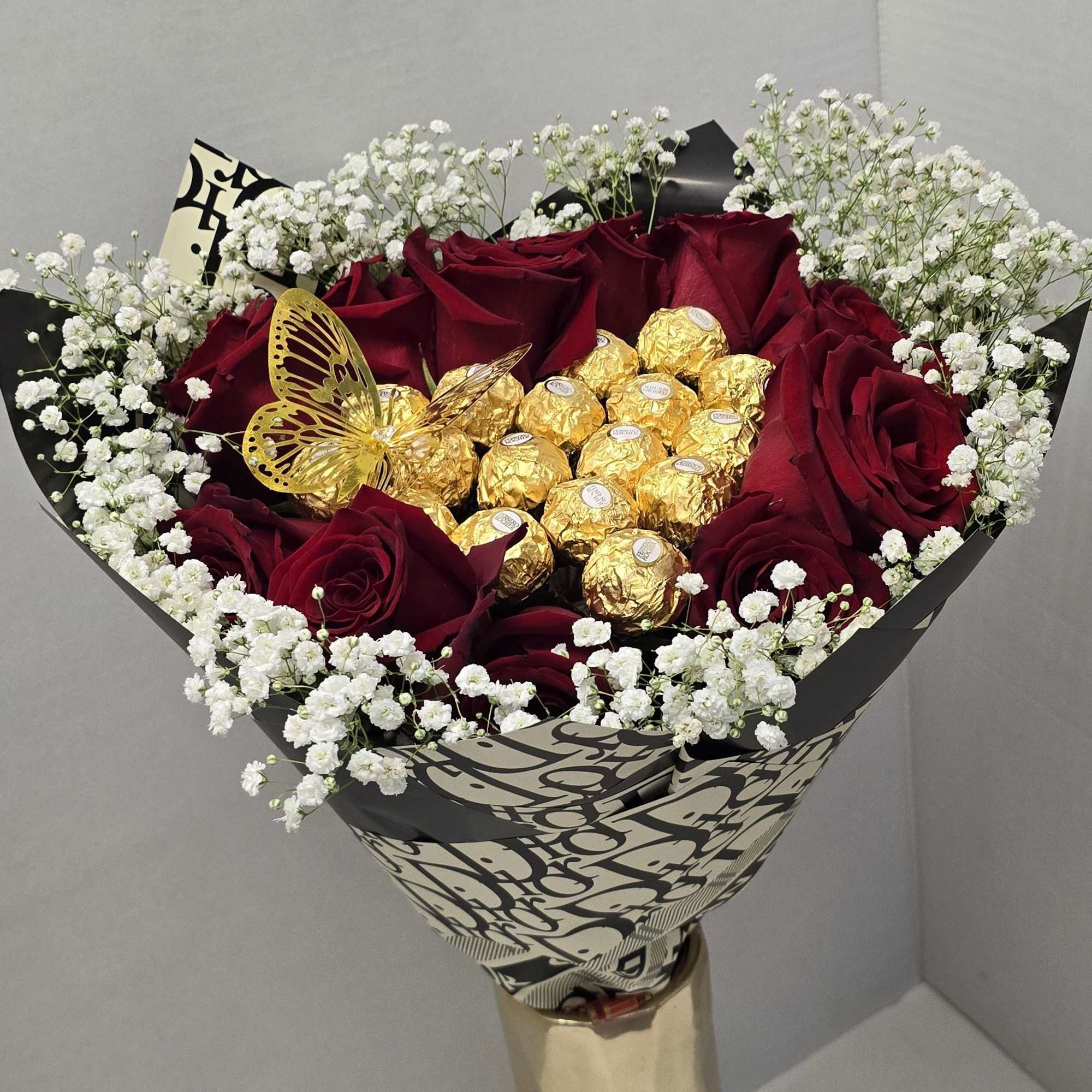This is a beautiful bouquet of red roses and a heart of