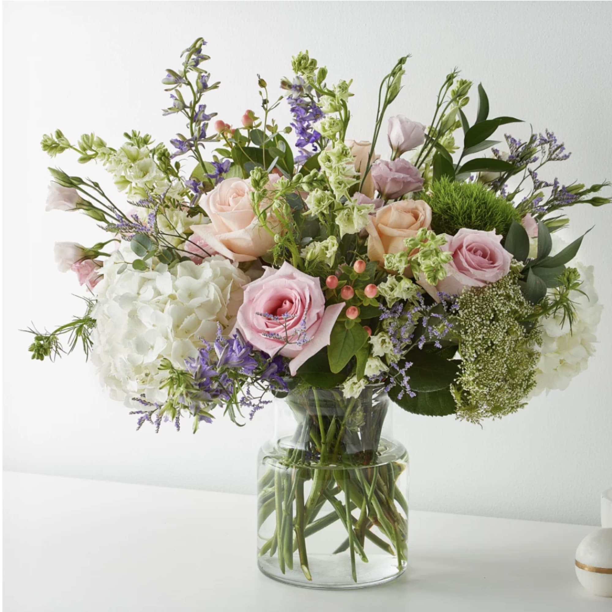 With its beautiful blend of roses, larkspurs, hypericum berries, Queen Anne&#039;s Lace