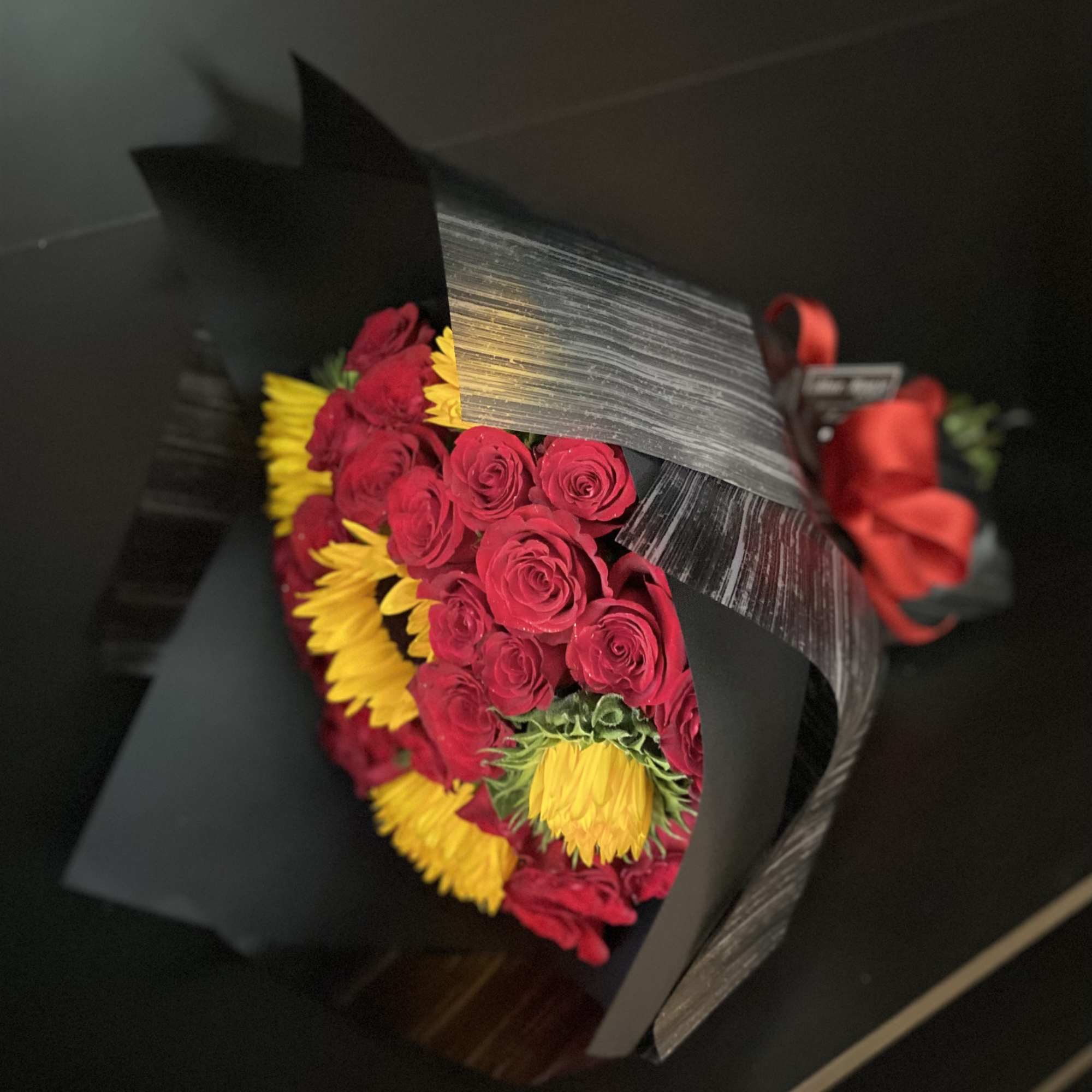 24 Red Roses and 5 Sunflowers wrapped Black Paper