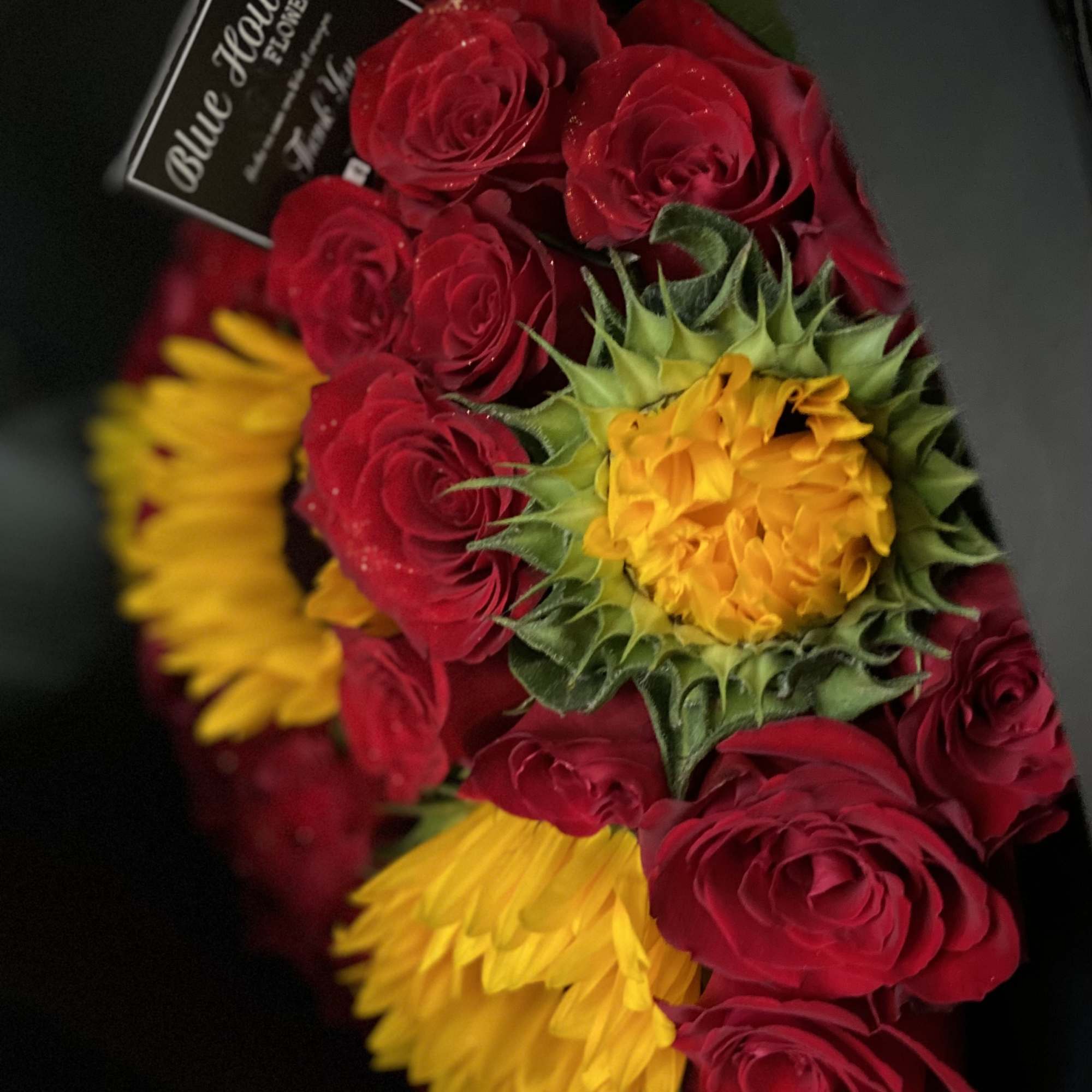 24 Red Roses and 5 Sunflowers wrapped Black Paper