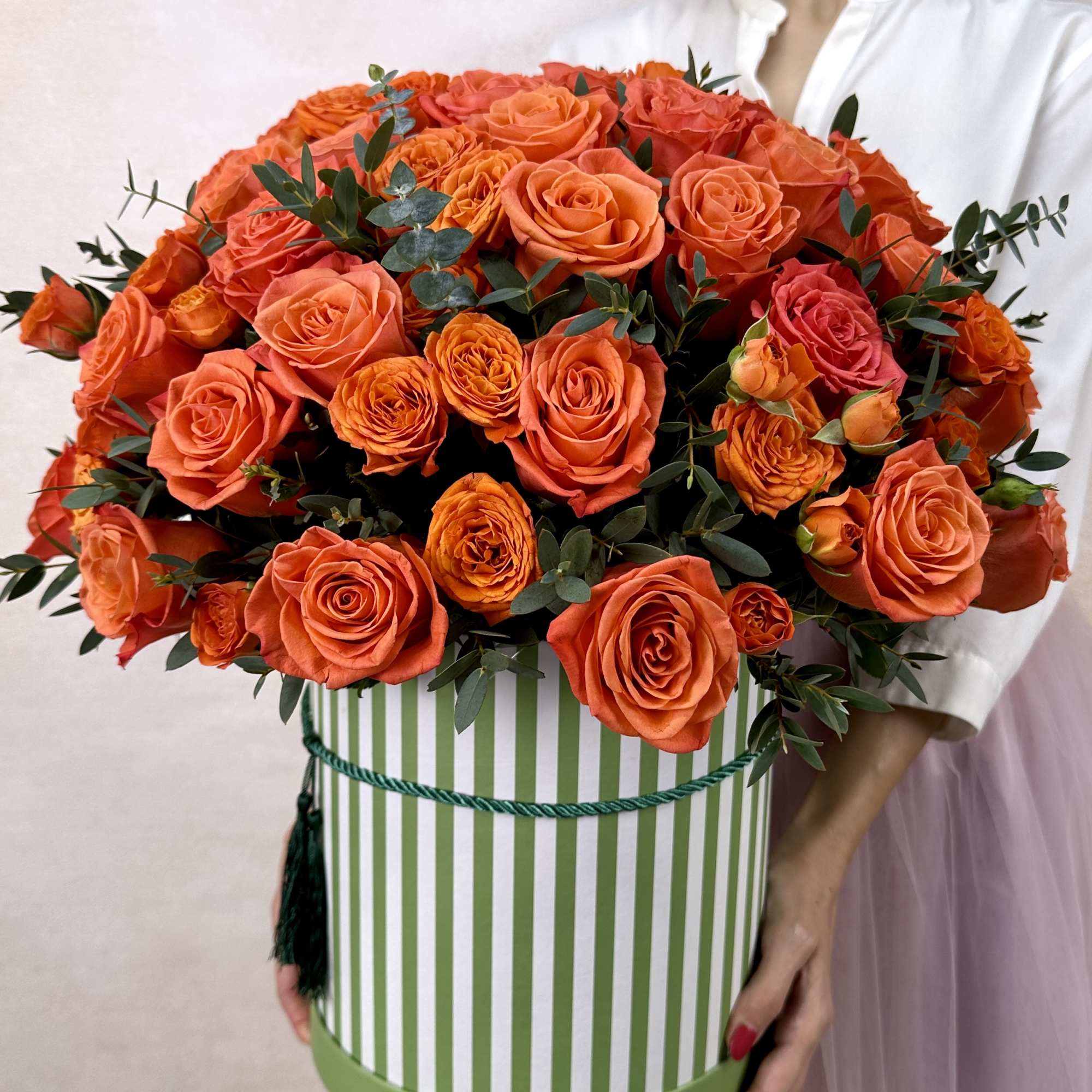 Vibrant and bold, our orange flower arrangements in a box ignite joy