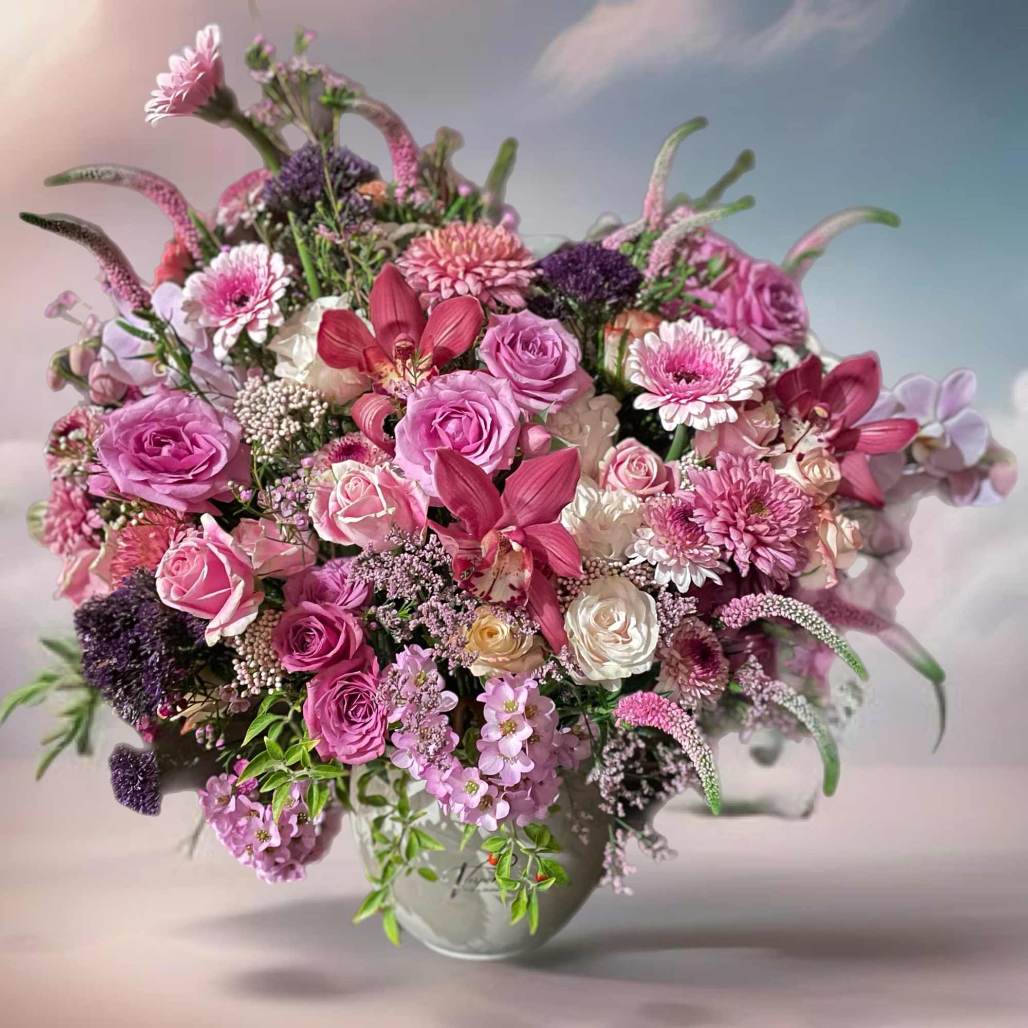 Marvelous composition with chrysanthemums, orchids, roses, Veronica, and many other flowers .