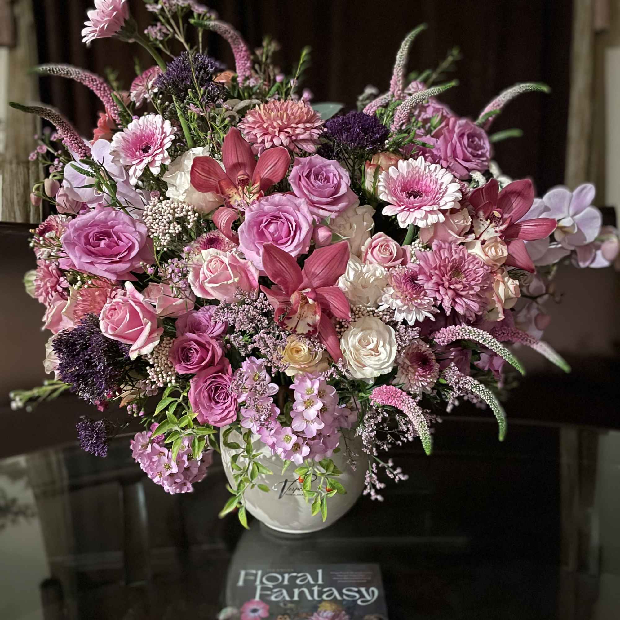 Marvelous composition with chrysanthemums, orchids, roses, Veronica, and many other flowers .