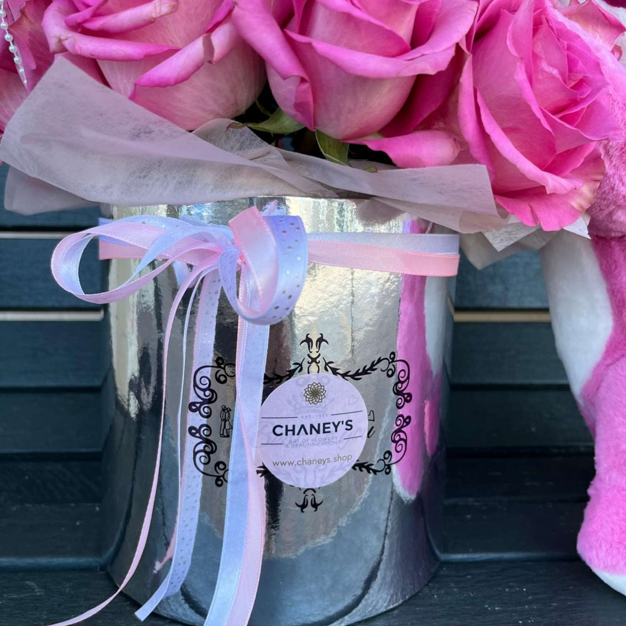 30 roses in a floral box with the legendary strawberry bear. Choose