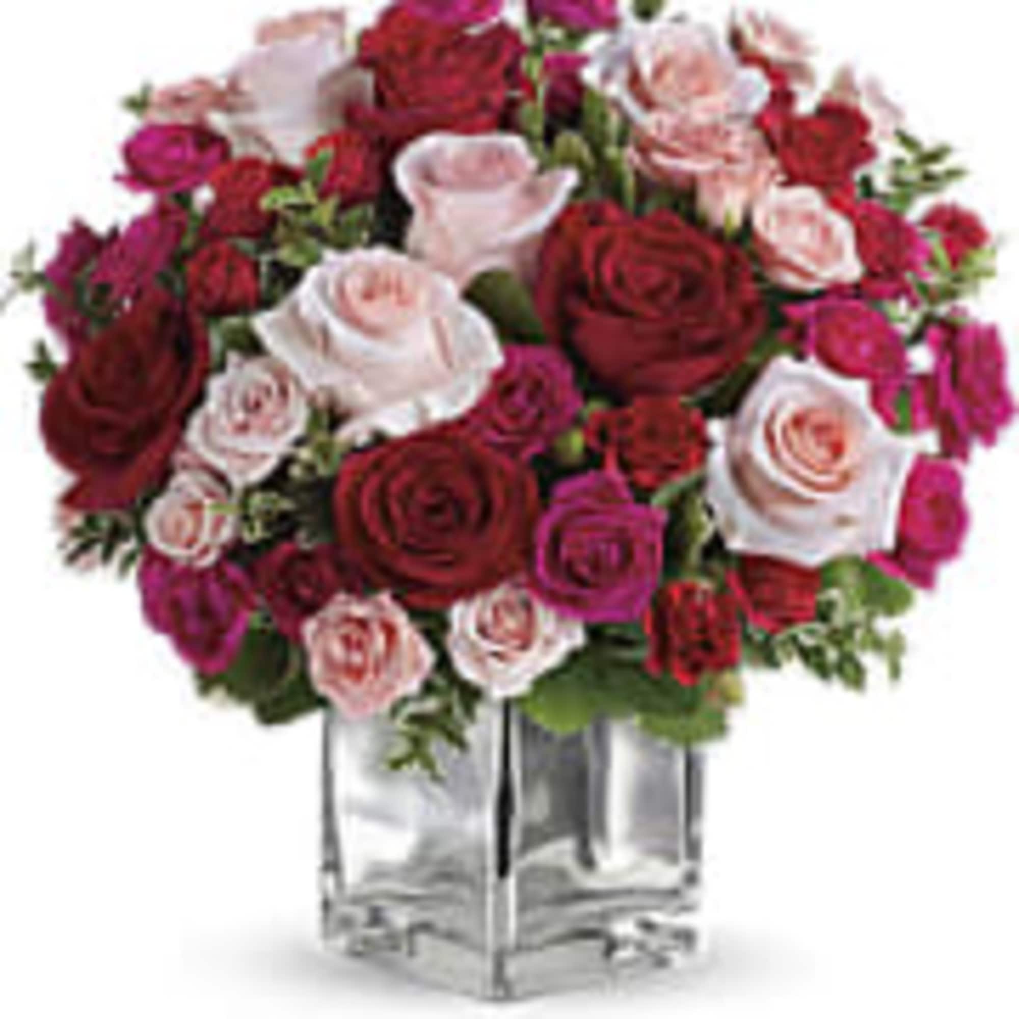 This beautiful arrangement made with roses and spray in red , hot