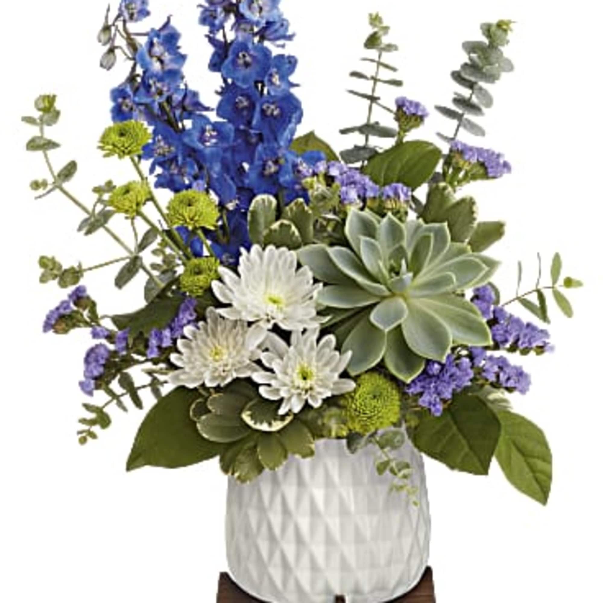  A modern  ceramic planter arranged with blue delphinium, white cushion