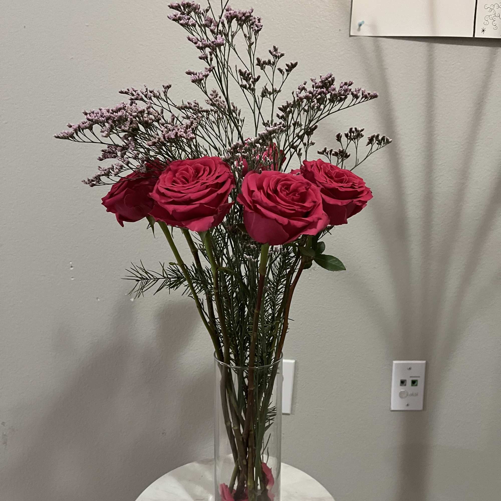 A combination of hot pink roses with the delicate charm of purple