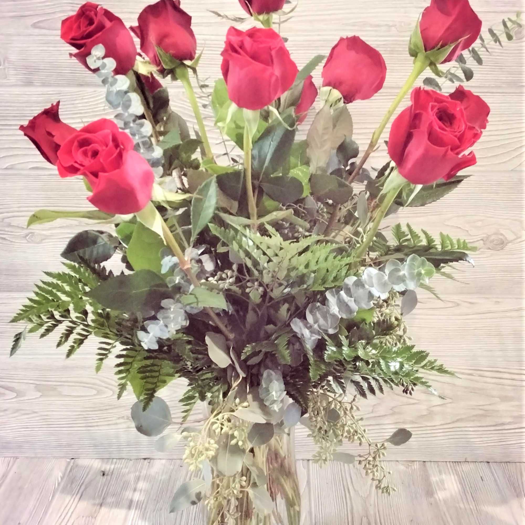 One Dozen (12) Long Stemmed Red Roses Arranged in a vase with