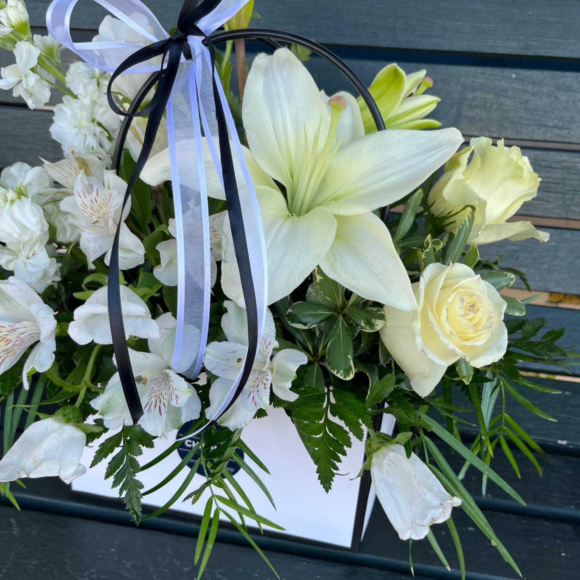 Elevate your occasion with this clear black &amp; white floral expression! Well