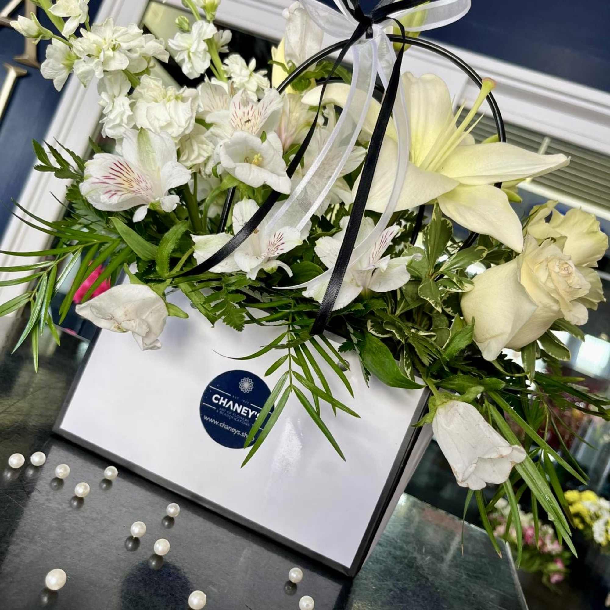 Elevate your occasion with this clear black &amp; white floral expression! Well