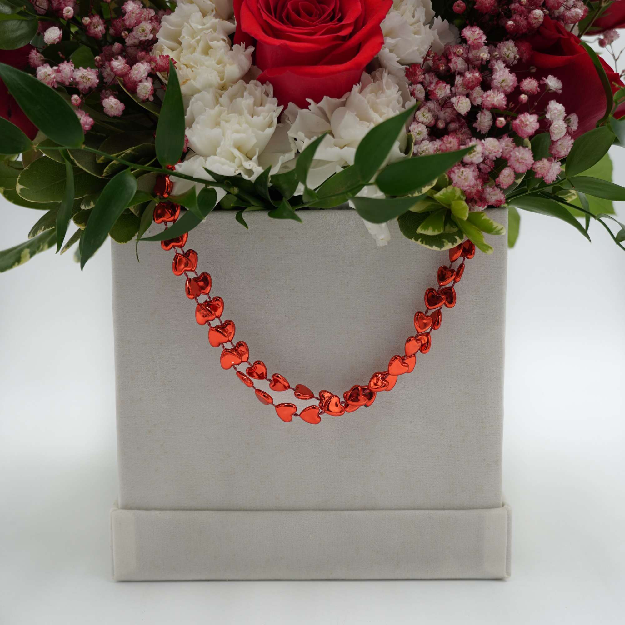 Includes Red Roses, Carnations, baby breaths, and mixed greenery 
Square Plush Box Includes Red Roses, Carnations, baby breaths, and mixed greenery 
Square Plush Box