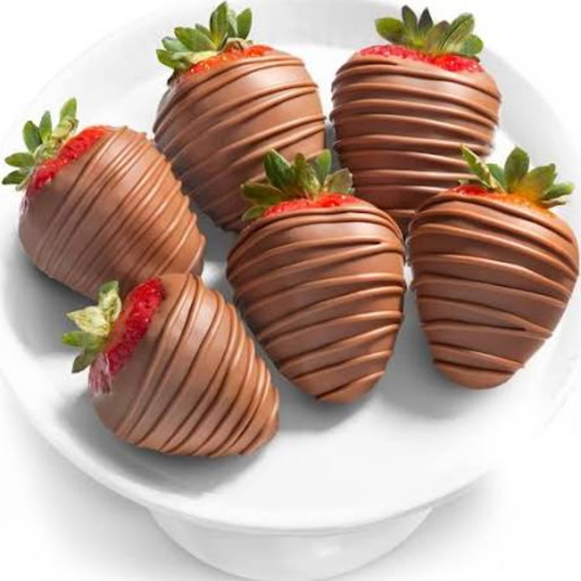 The way to their heart? Our romantic dipped berries, of course. Plump