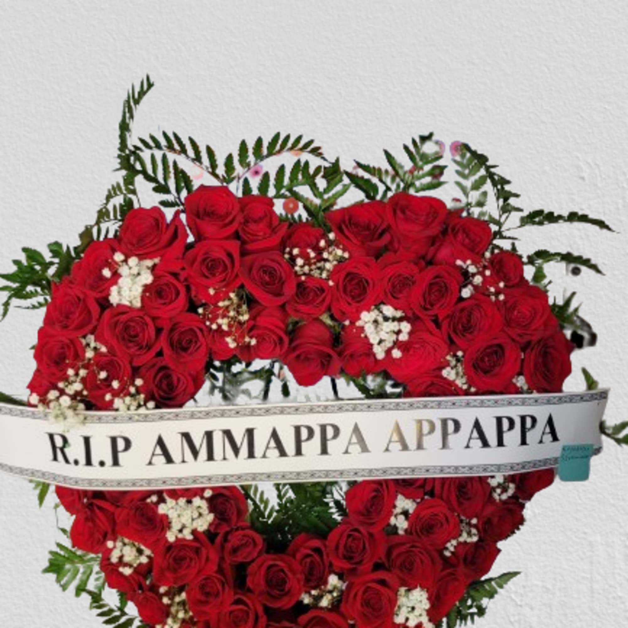 Funeral Arrangement in open heart shape with red roses and babies breath