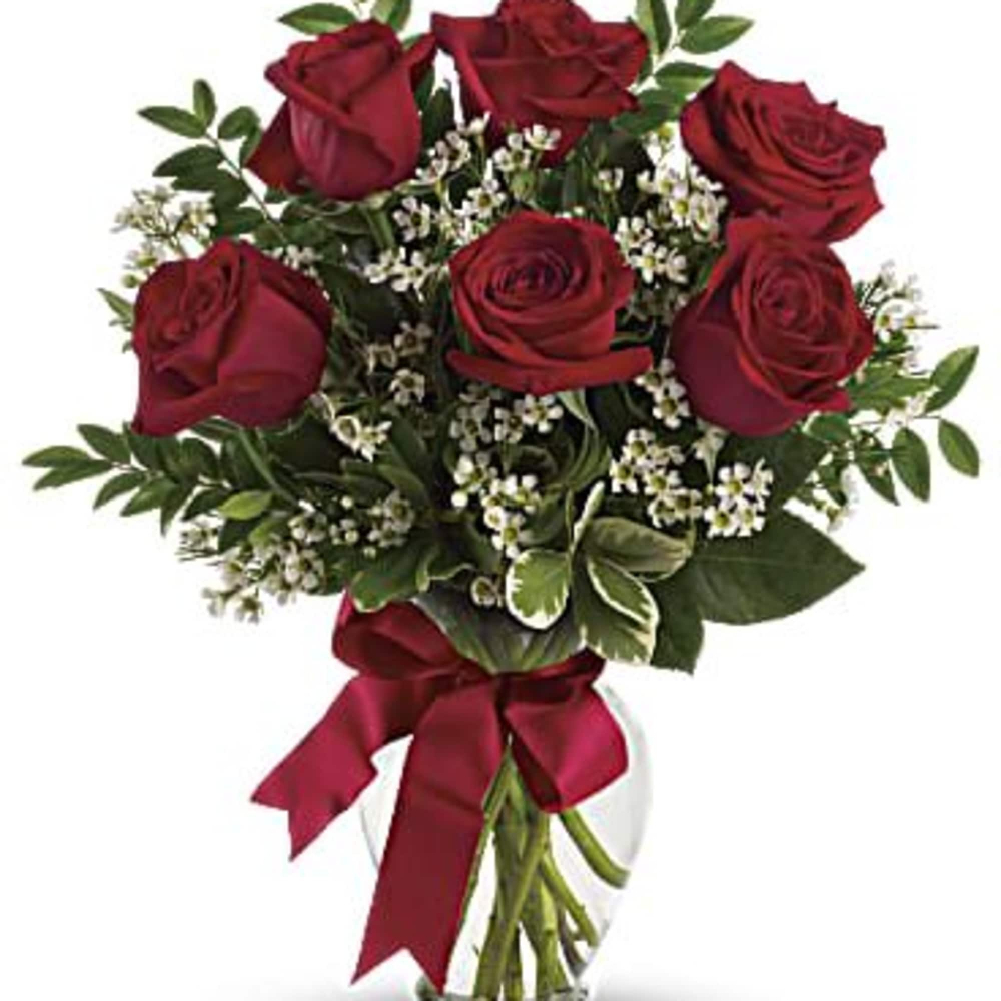 This charming bouquet includes three red roses accented with white waxflower, huckleberry