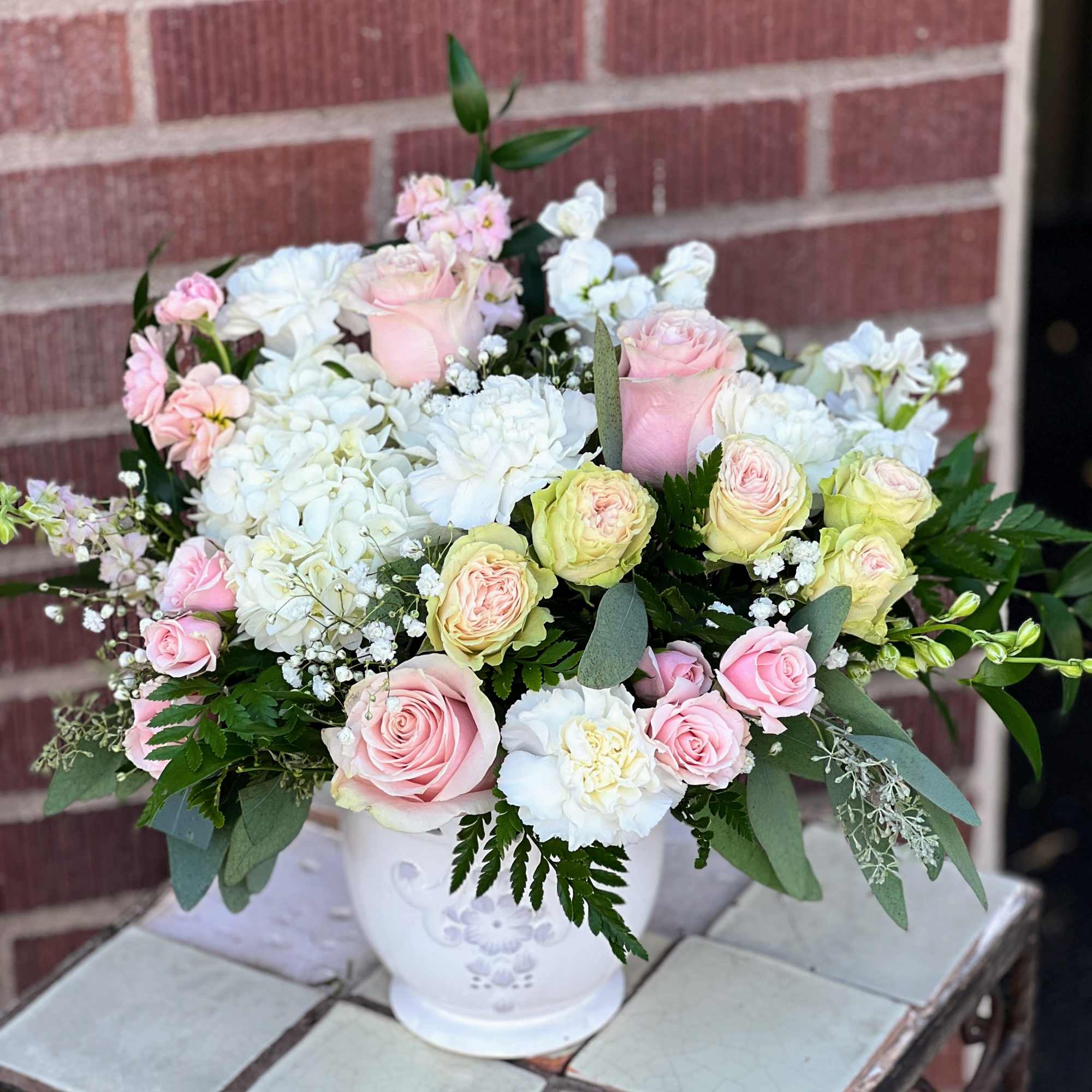 Delviered in a lovely keepsake ceramic this bouquet features hydrangea, roses and Delviered in a lovely keepsake ceramic this bouquet features hydrangea, roses and