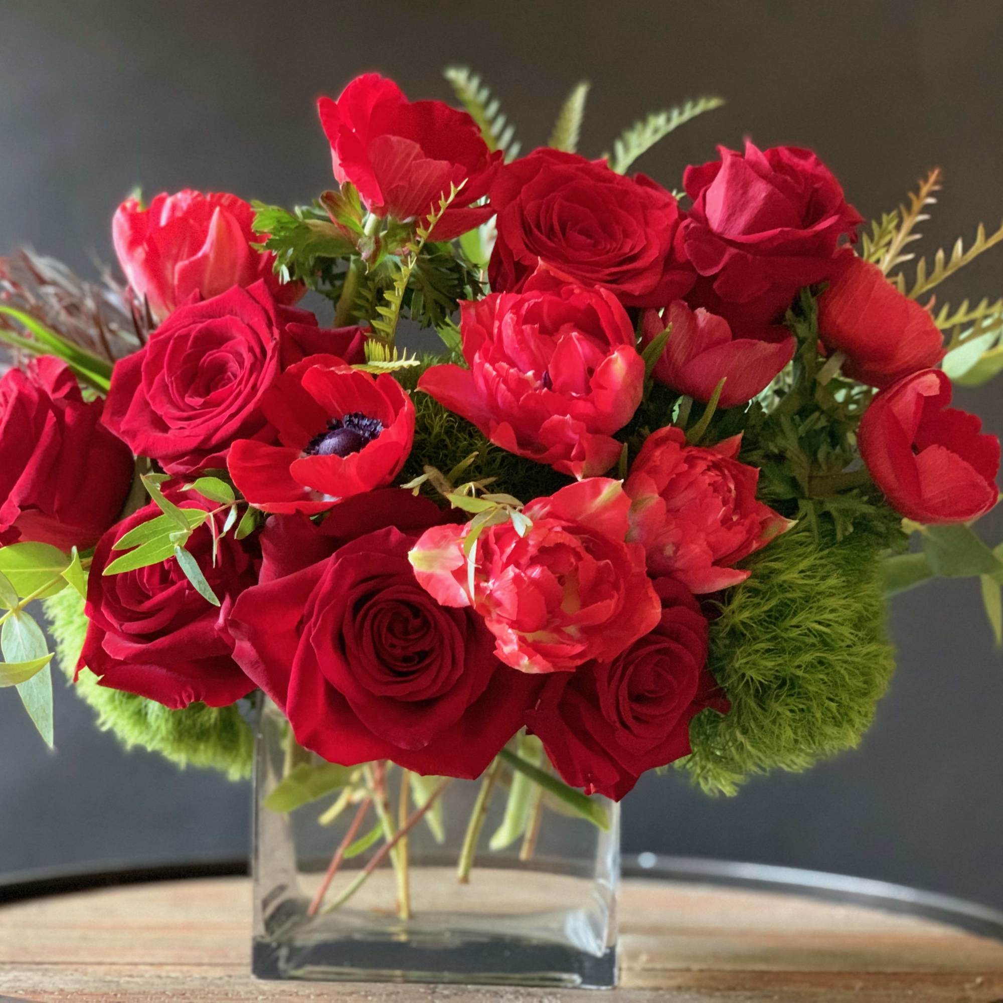 Make an impression with this unique, exquisite design. Stunning vibrant red arrangement:
