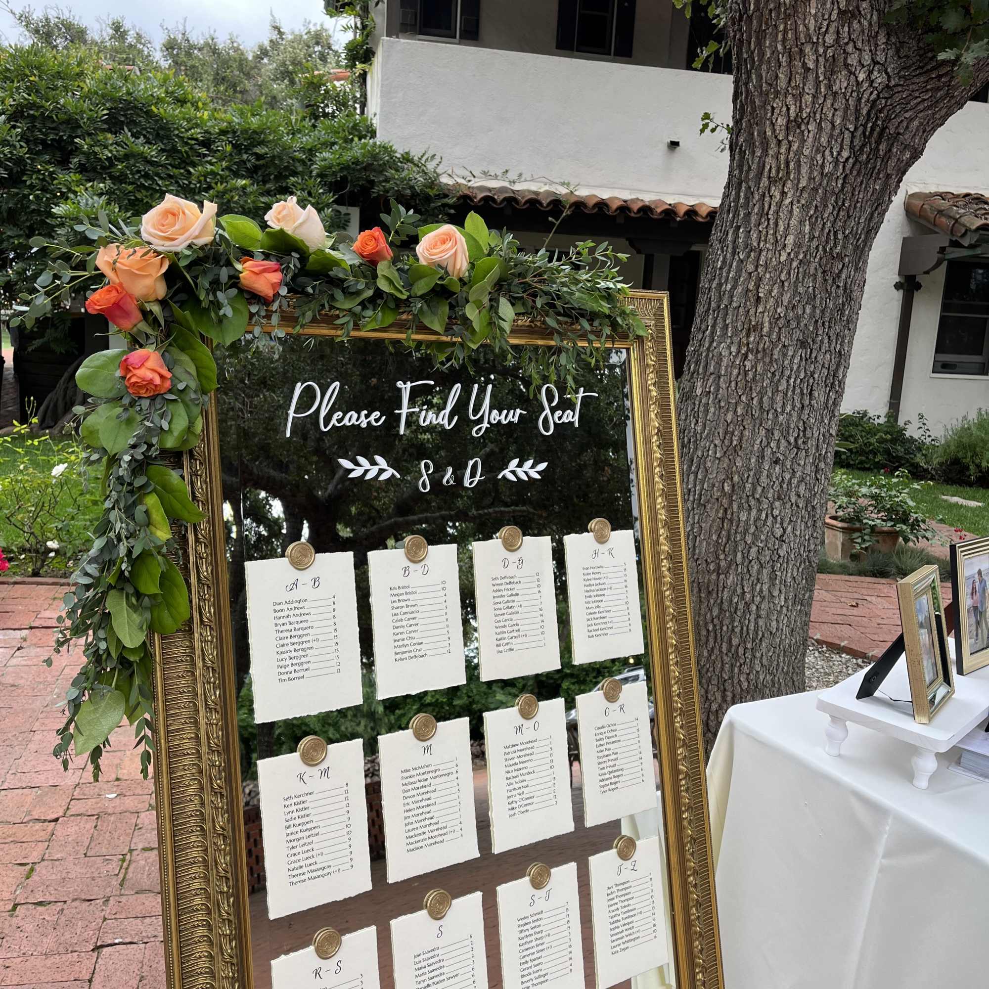 Easel, Fresh Green Garland, and Mirror Package Rental
Flowers for garland will be