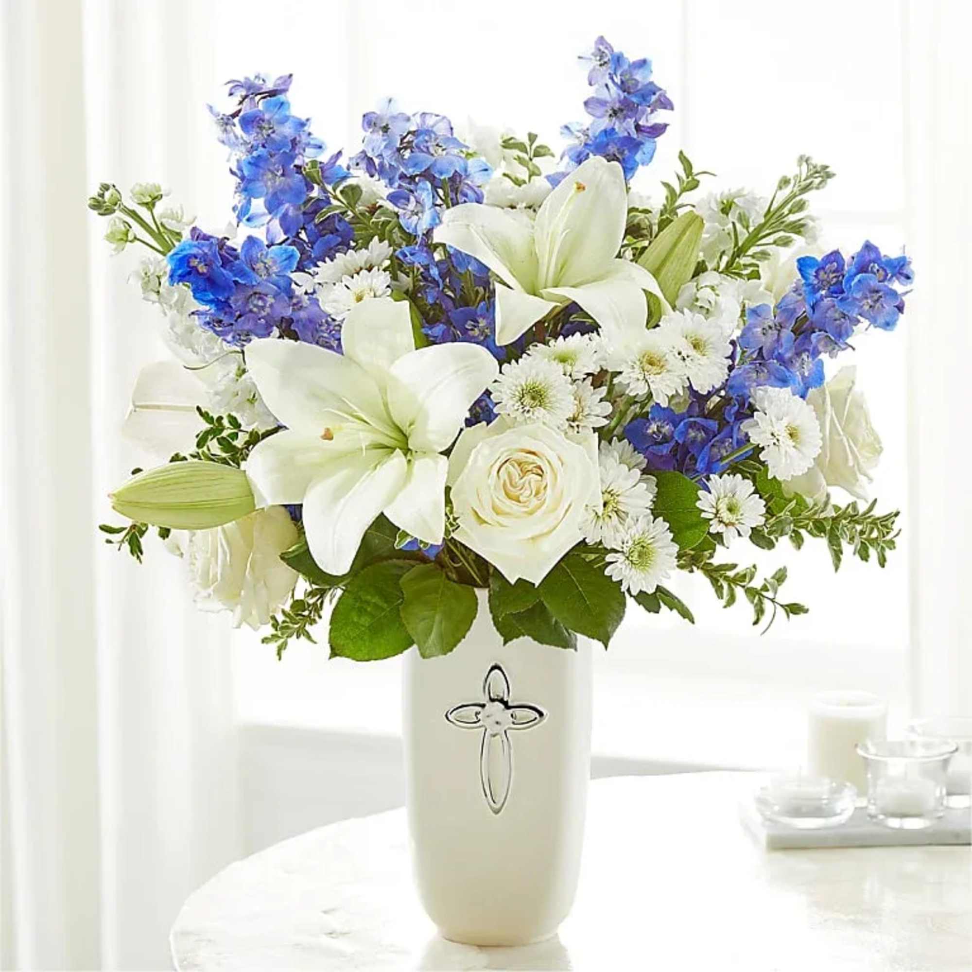 Heavenly blossoms indeed, this bouquet makes a beautiful gift to offer condolences