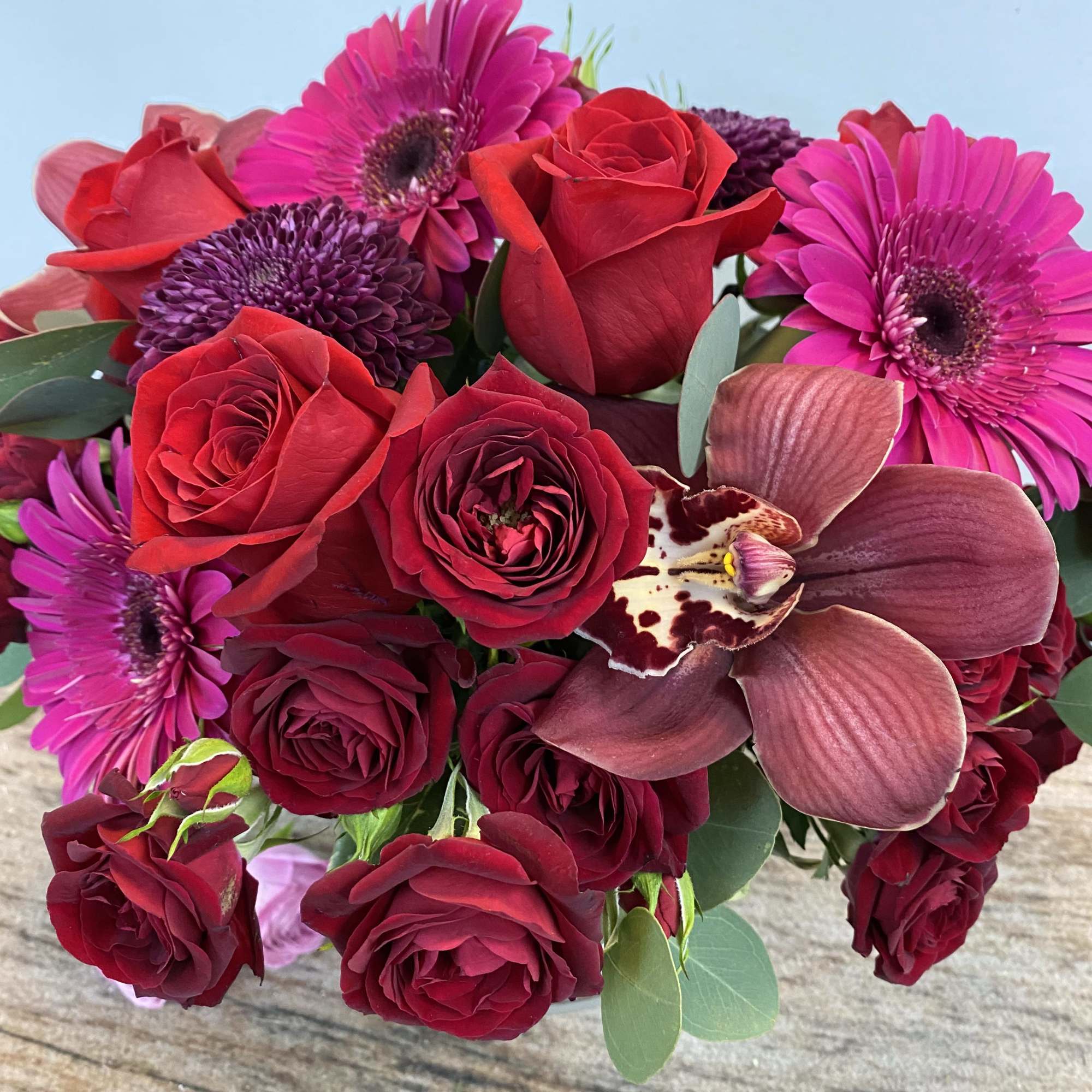 A full, hot mix of red and pink toned florals.
12&quot;x15&quot;