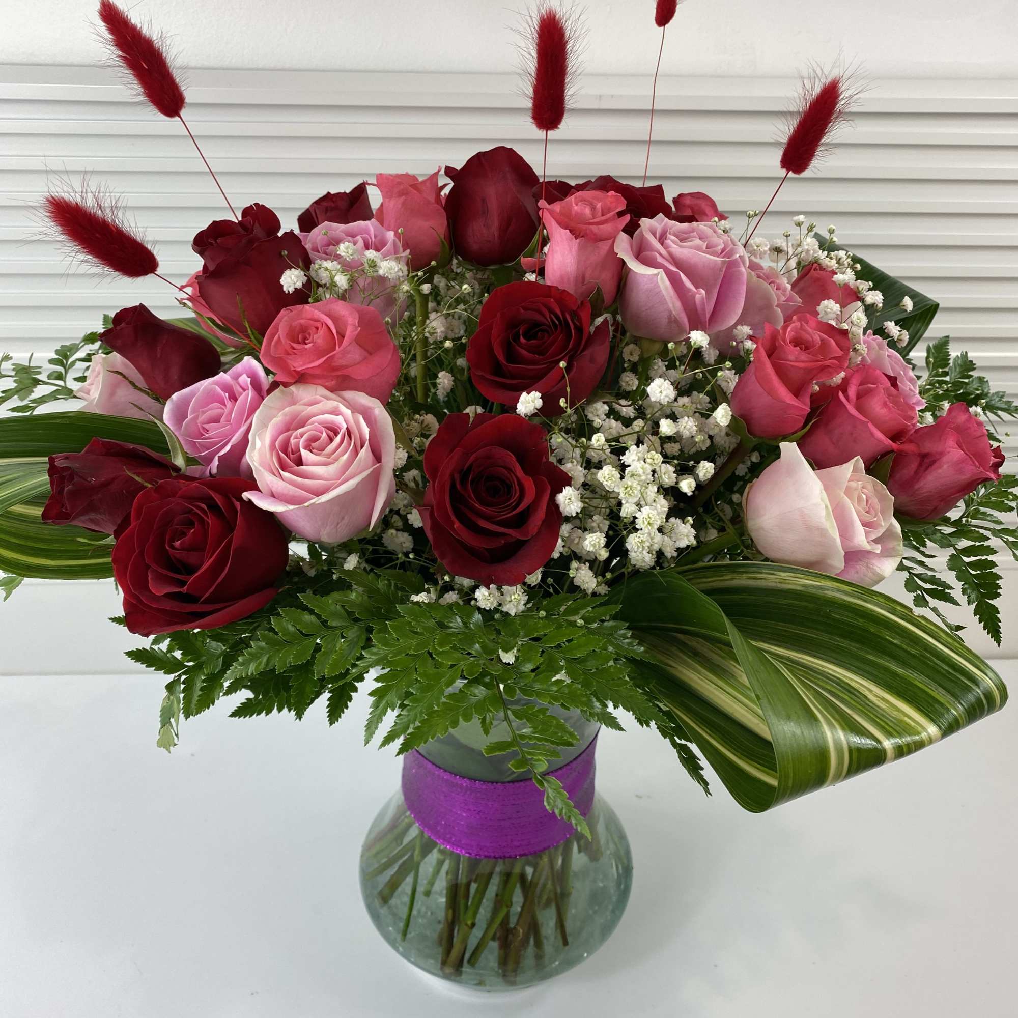 A rich mix of 2 dozen red roses and 1 dozen pink