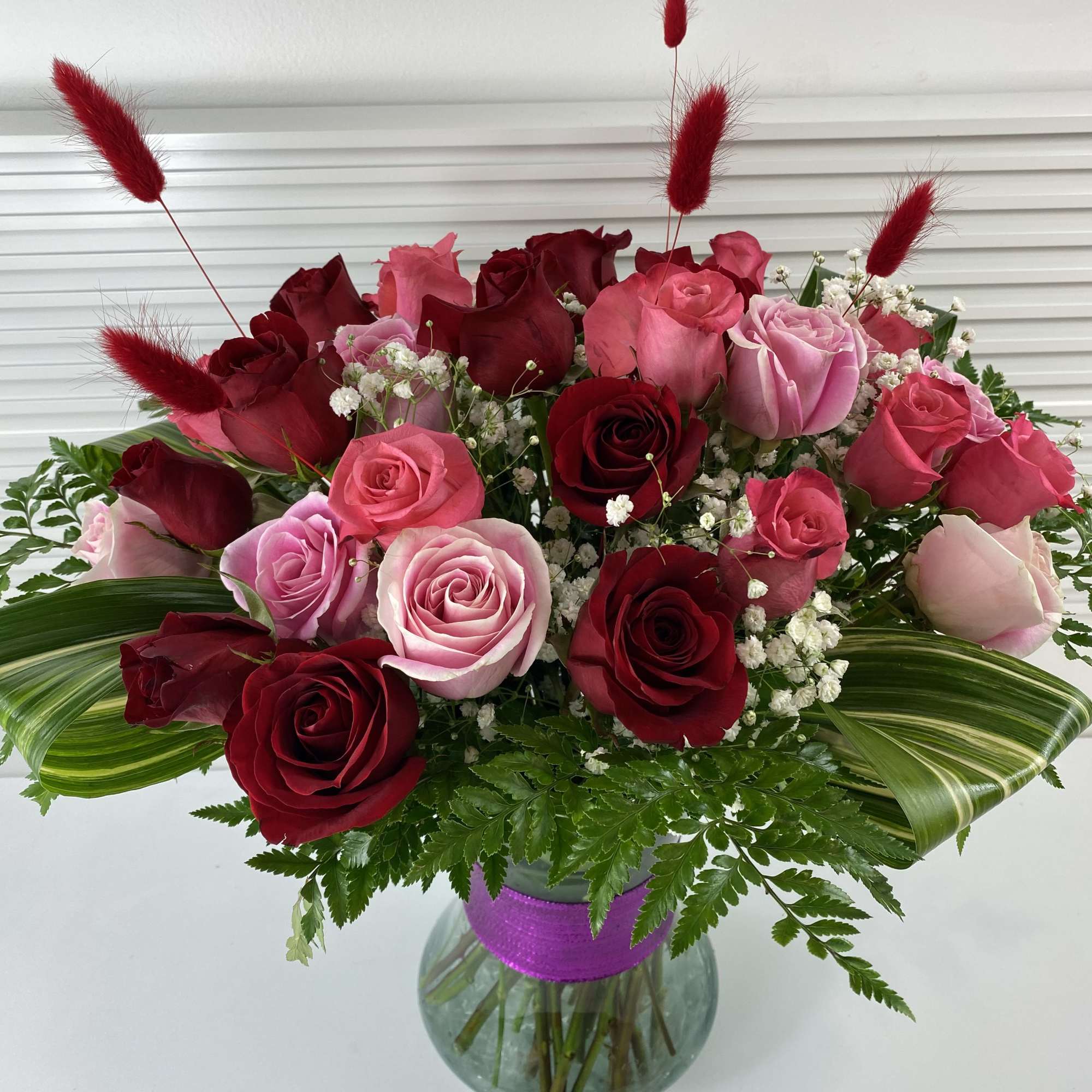 A rich mix of 2 dozen red roses and 1 dozen pink