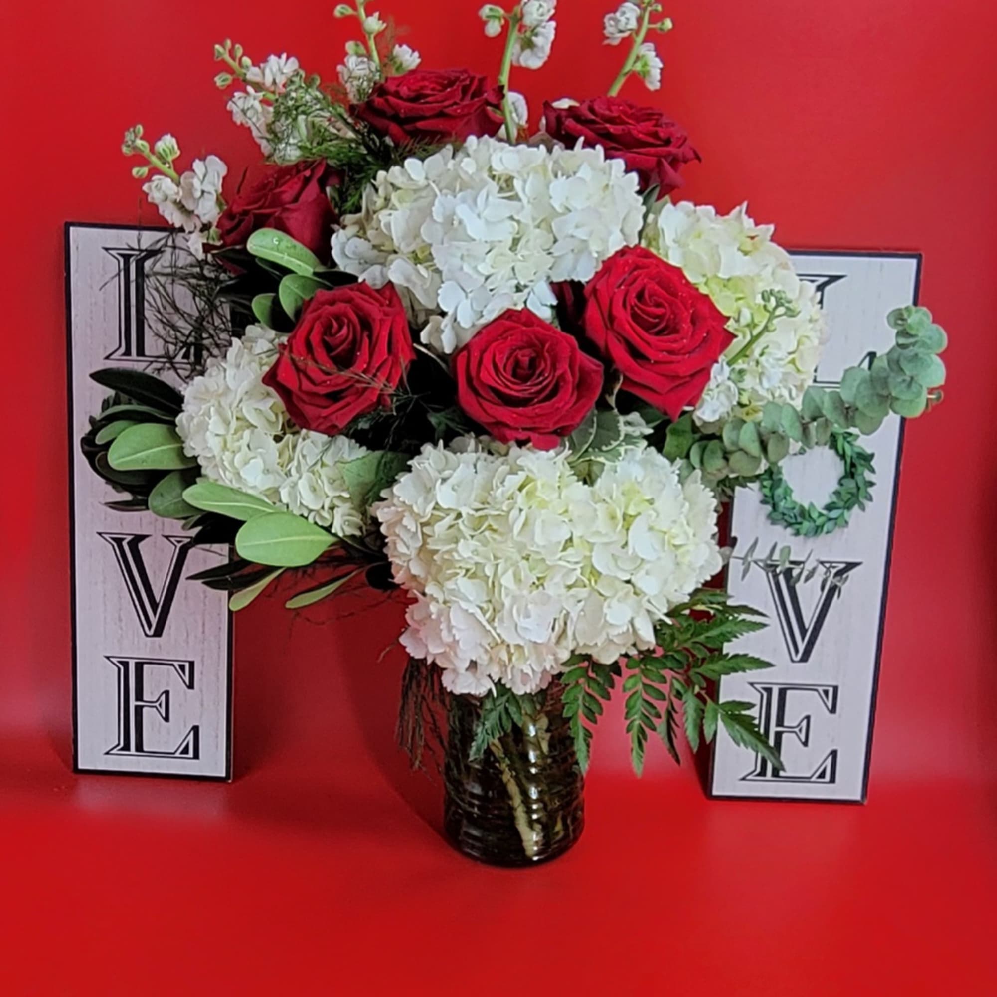 This elegant bouquet is
the perfect combination
of red roses love and romance with