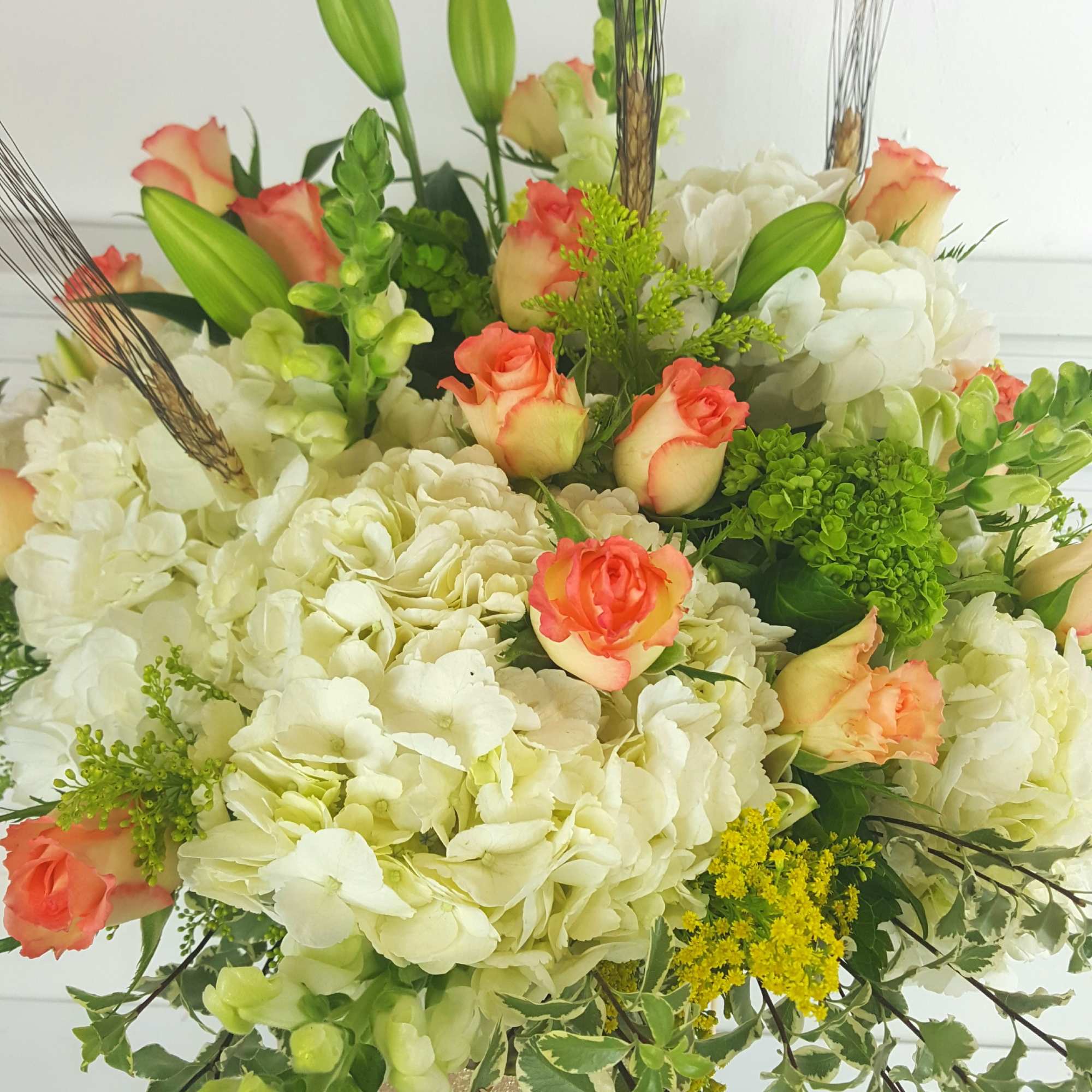 Impressive tall arrangement in a 16" cylinder clear vase field with white Impressive tall arrangement in a 16" cylinder clear vase field with white