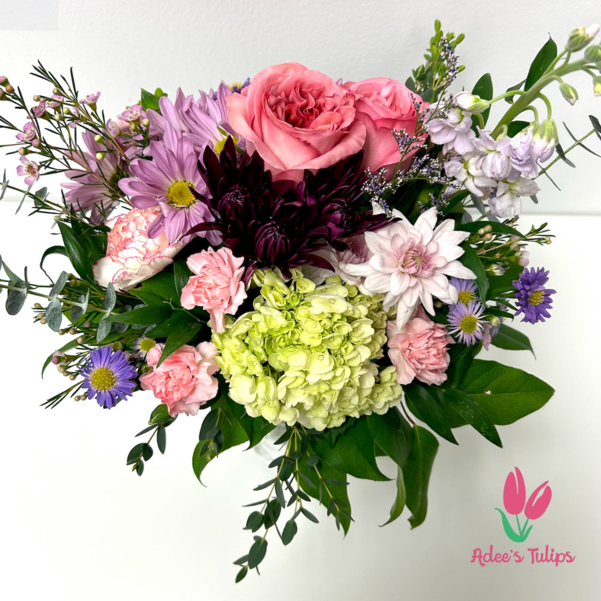 A light and airy wildflower bouquet artfully arranged to provide a pop