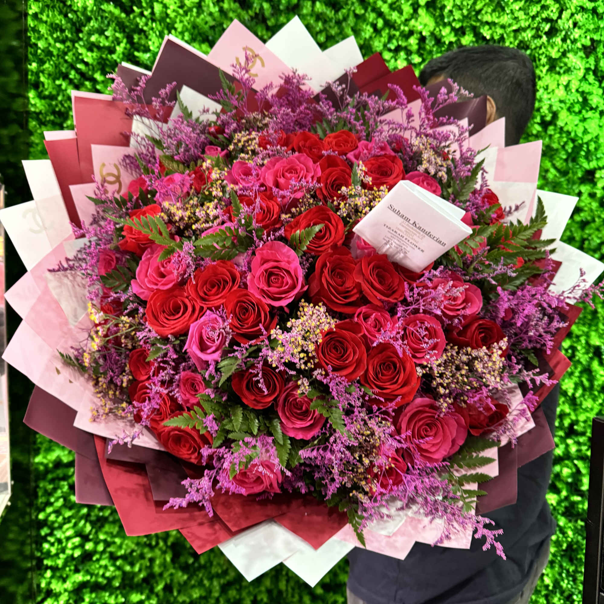 The &quot;Crimson Elegance&quot; bouquet is a captivating blend of rich red and